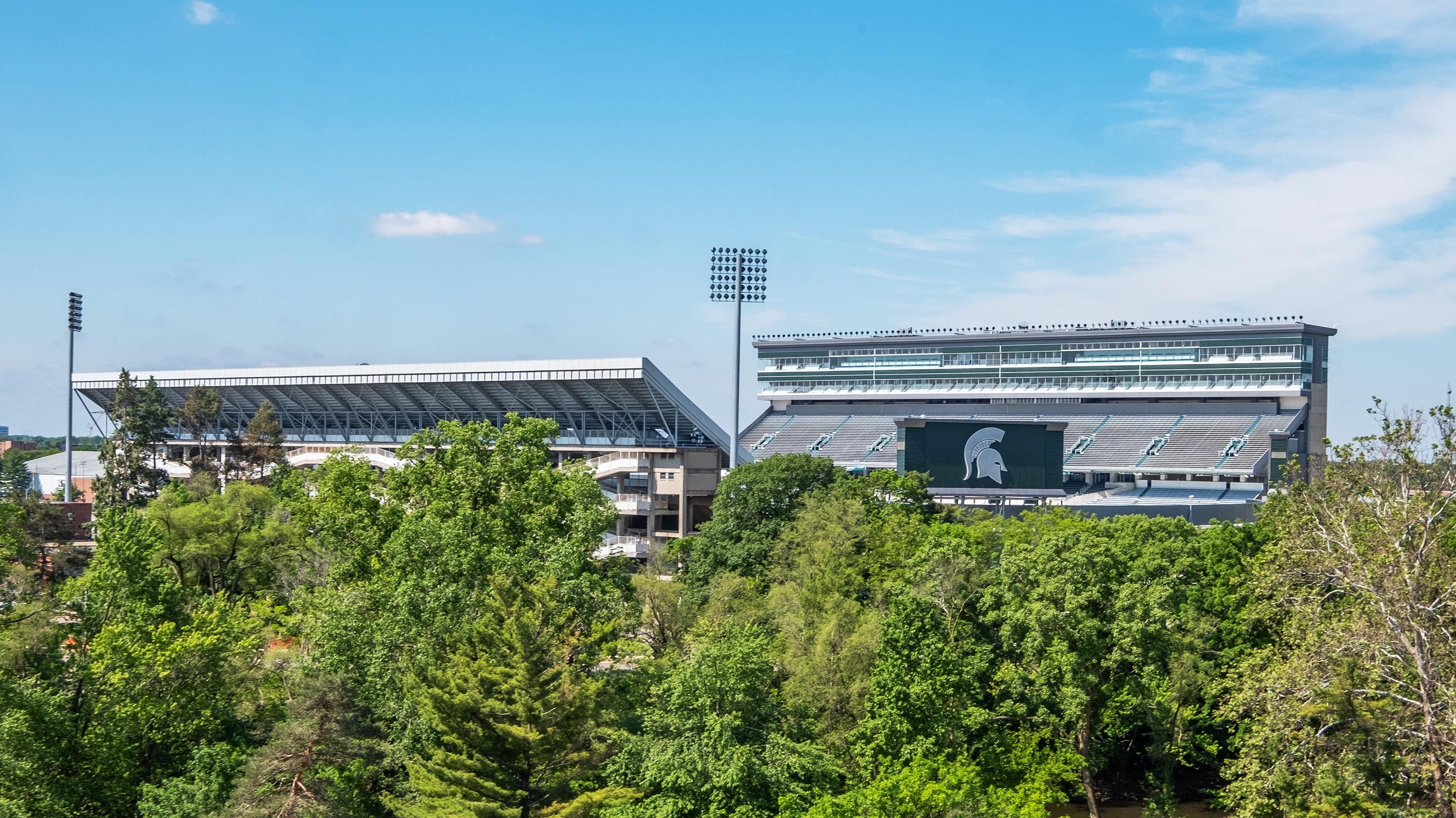 A view of Spartan Stadium from above the treeline
