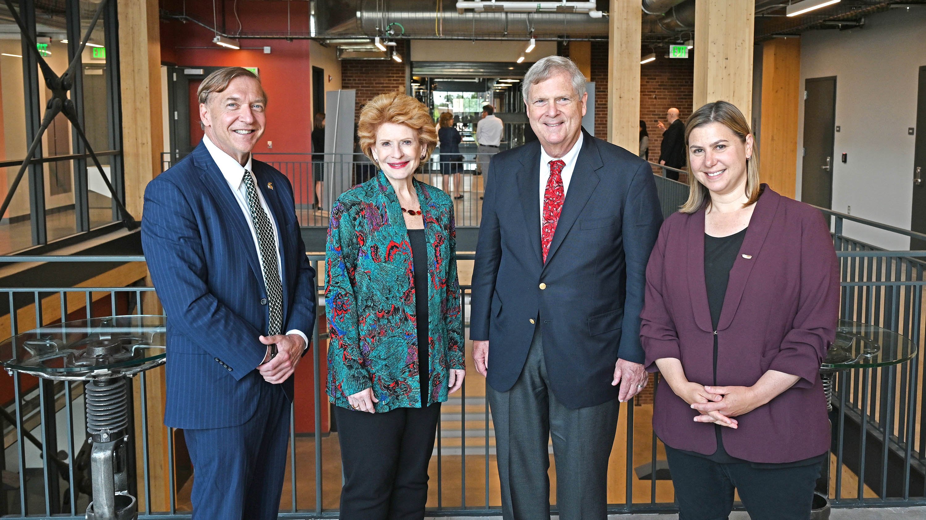President Samuel Stanley, U.S. Sen. Debbie Stabenow, Secretary of Agriculture Tom Vilsack and U.S. Rep. Elissa Slotkin at the MSU STEM facility.