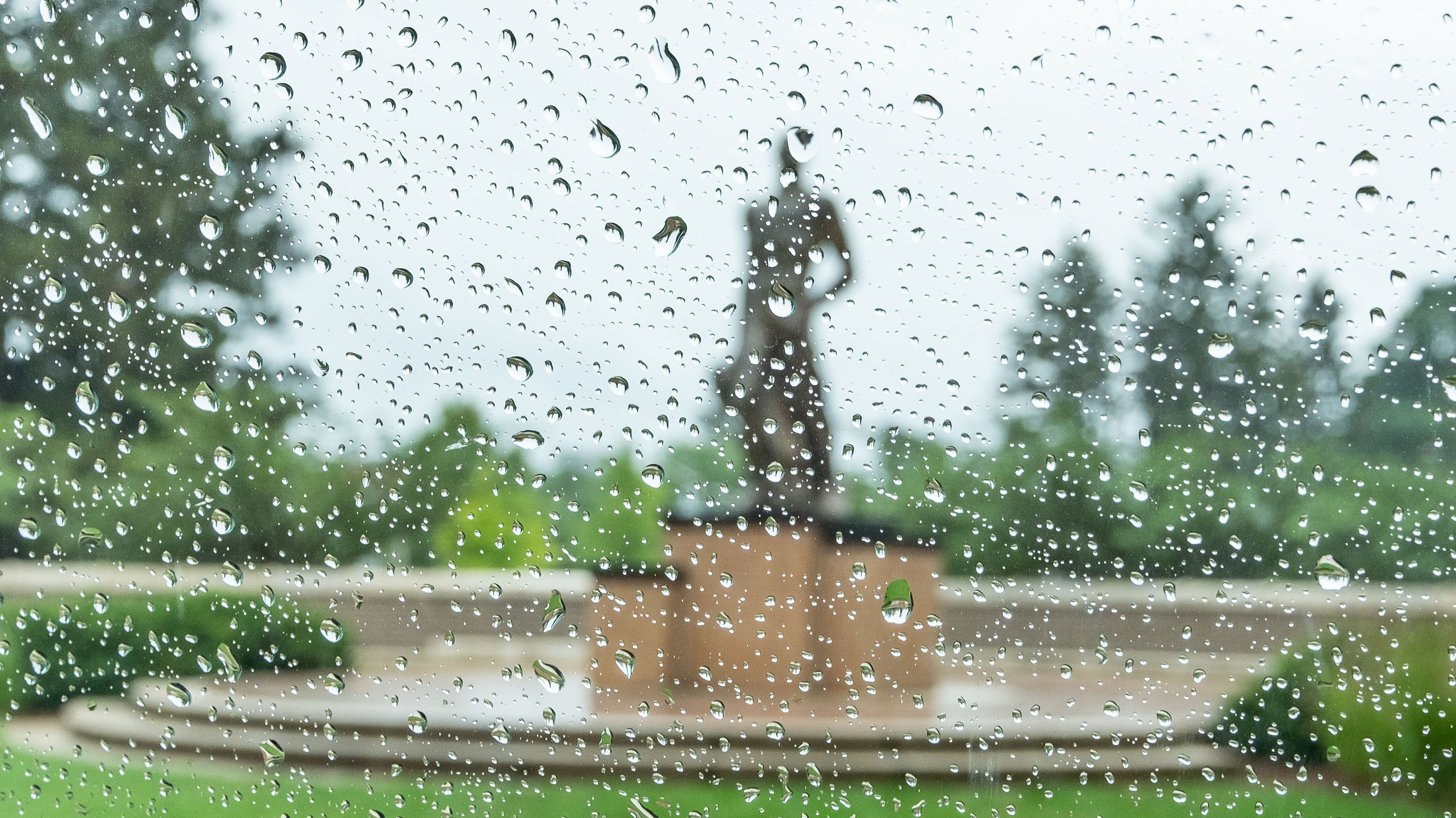The Spartan, obscured by raindrops on a car windshield