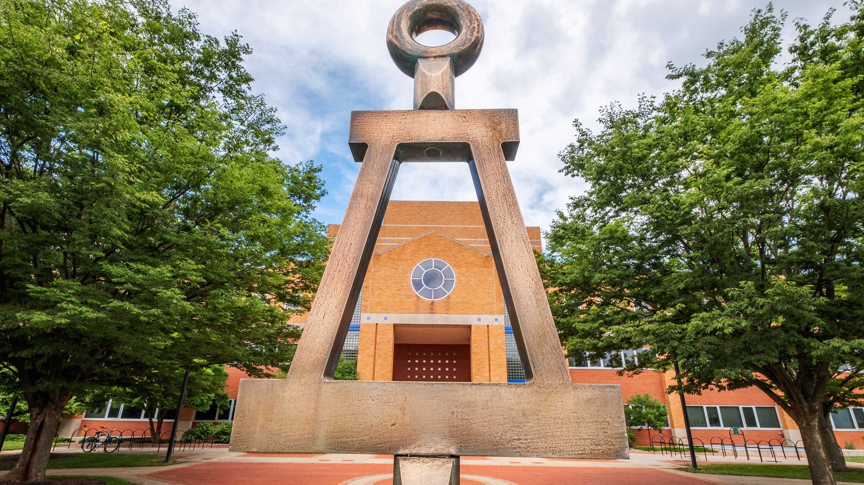 College of Engineering Building viewed through the Tau Beta Pi Engineering Honor Society Symbol.