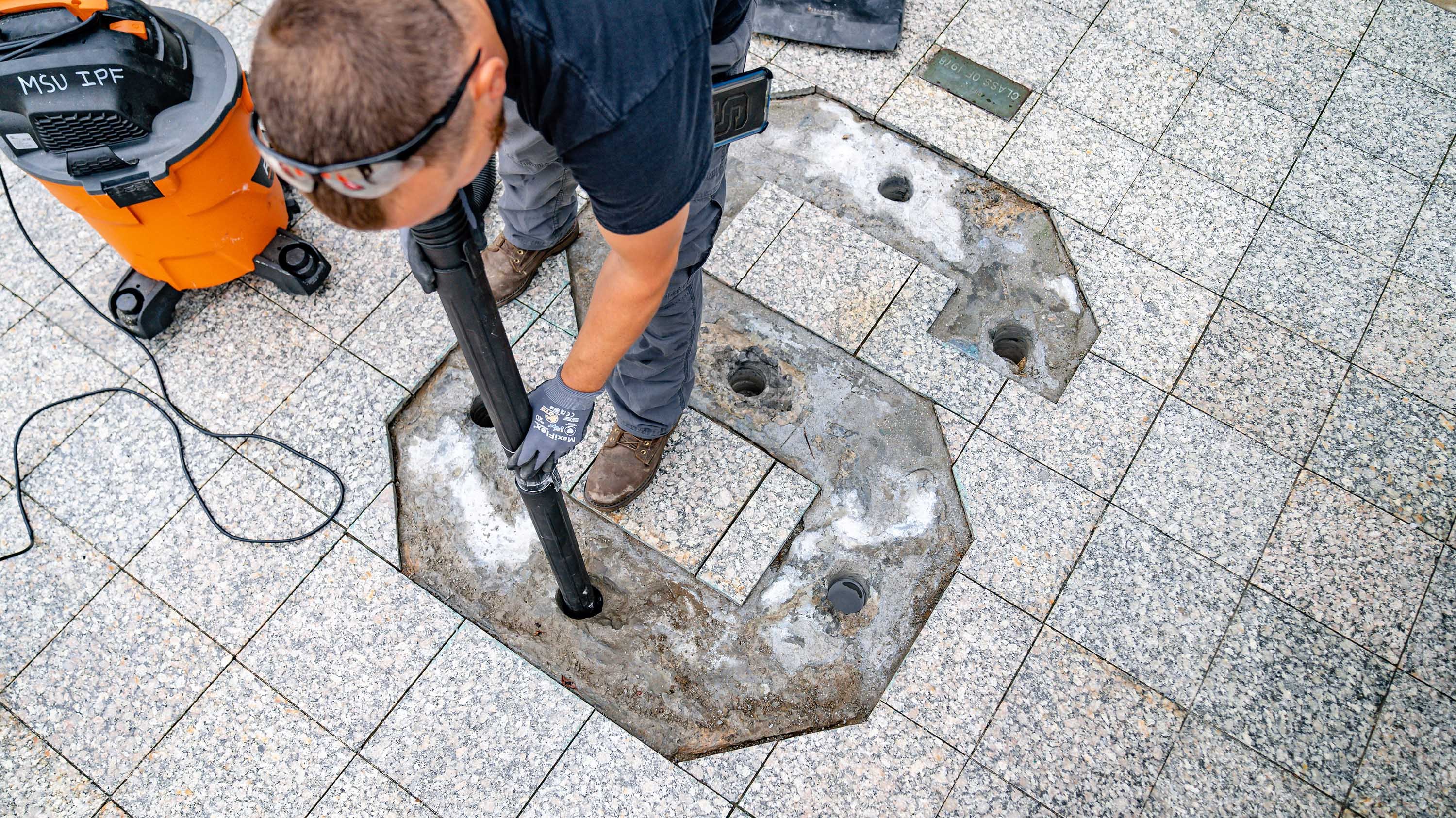 IPF crew cleaning out the spot where the bronze S is installed