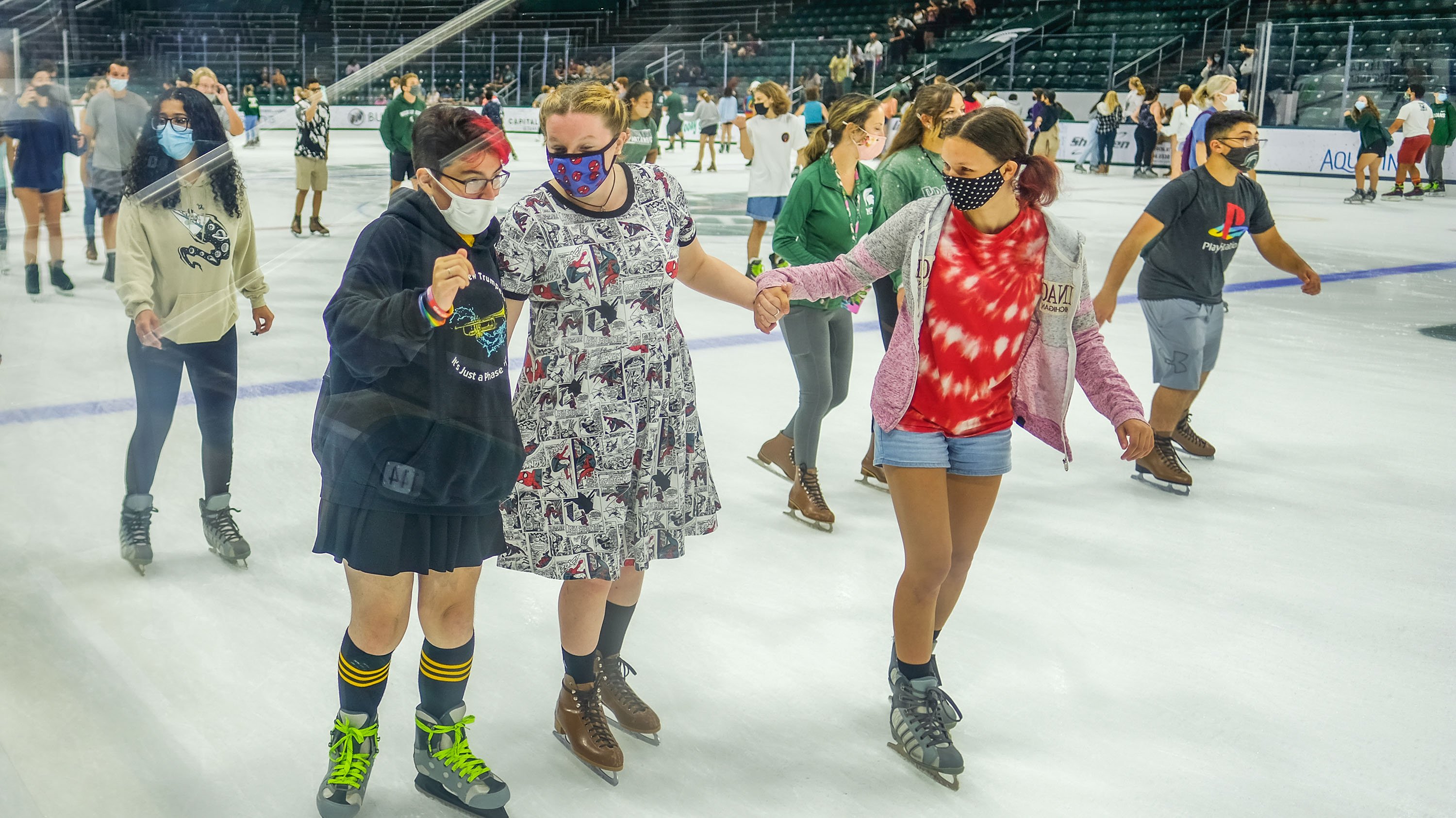 Students ice skating in Munn ice arena