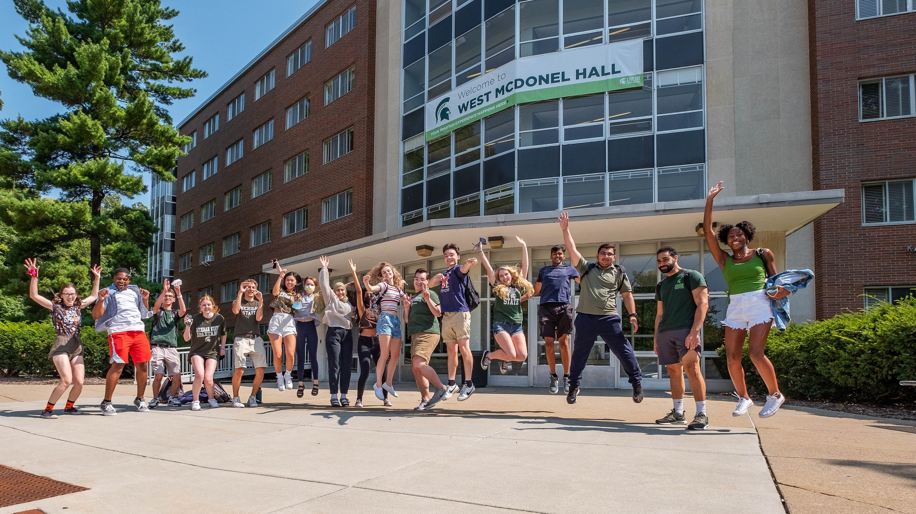 McDonel Hall RAs jumping in a line