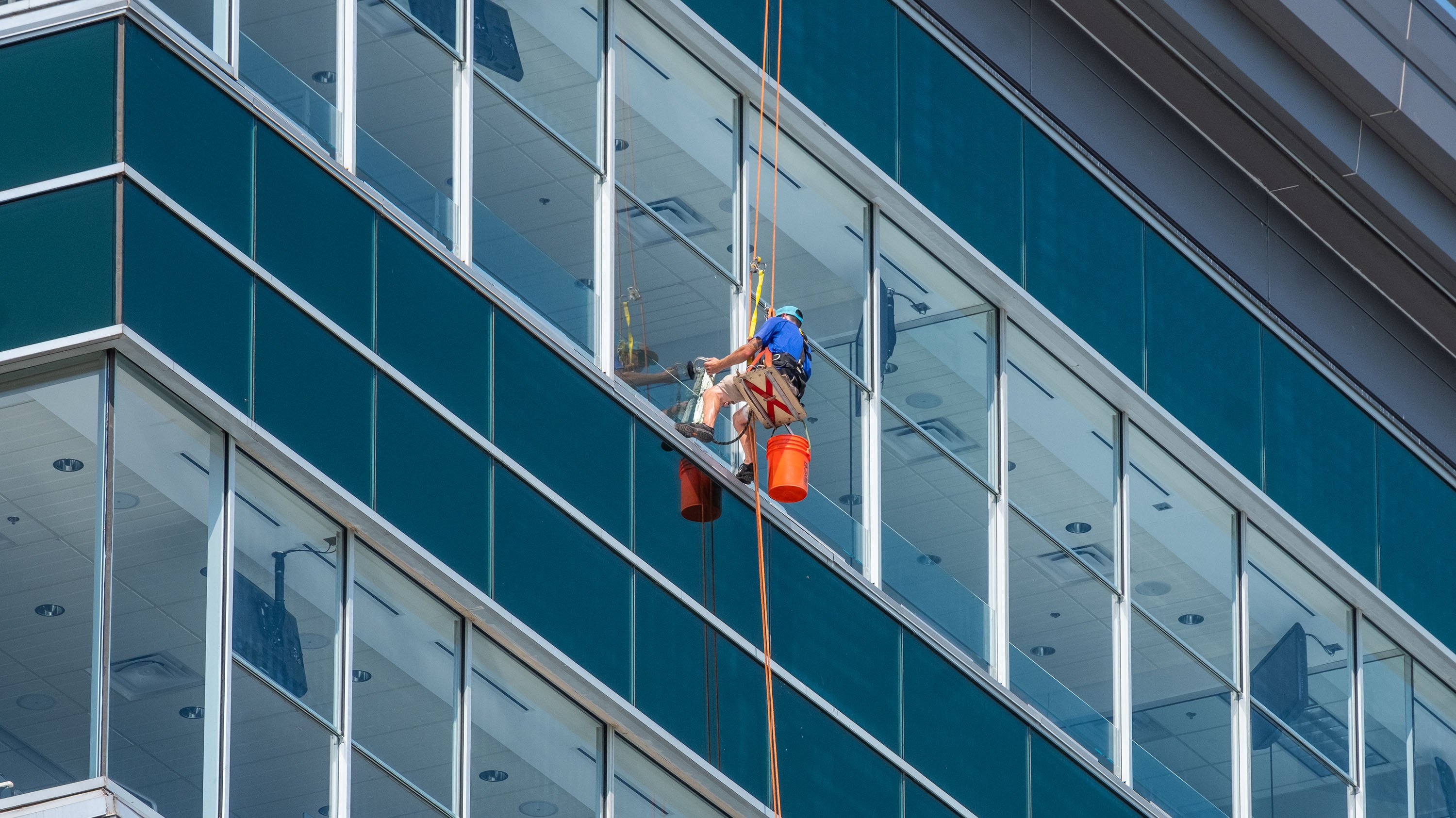 IPF crewmember washing a window