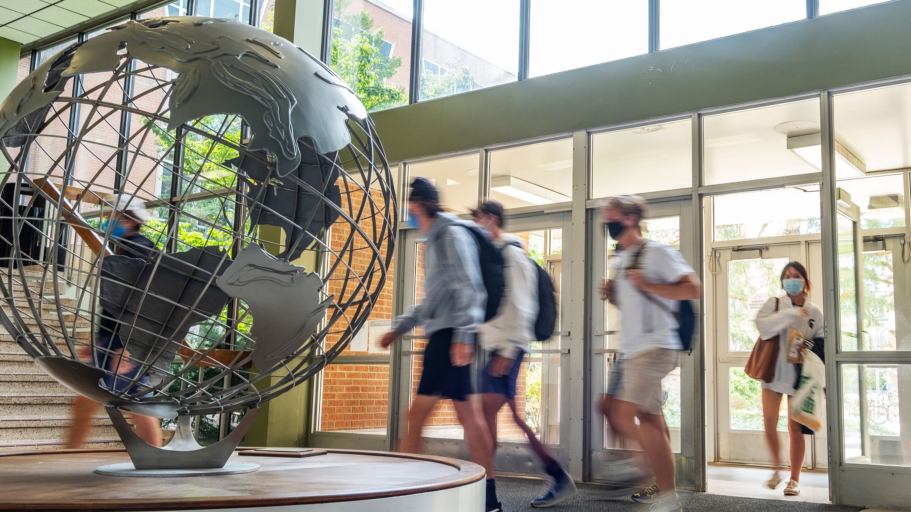 Students walking in International Center