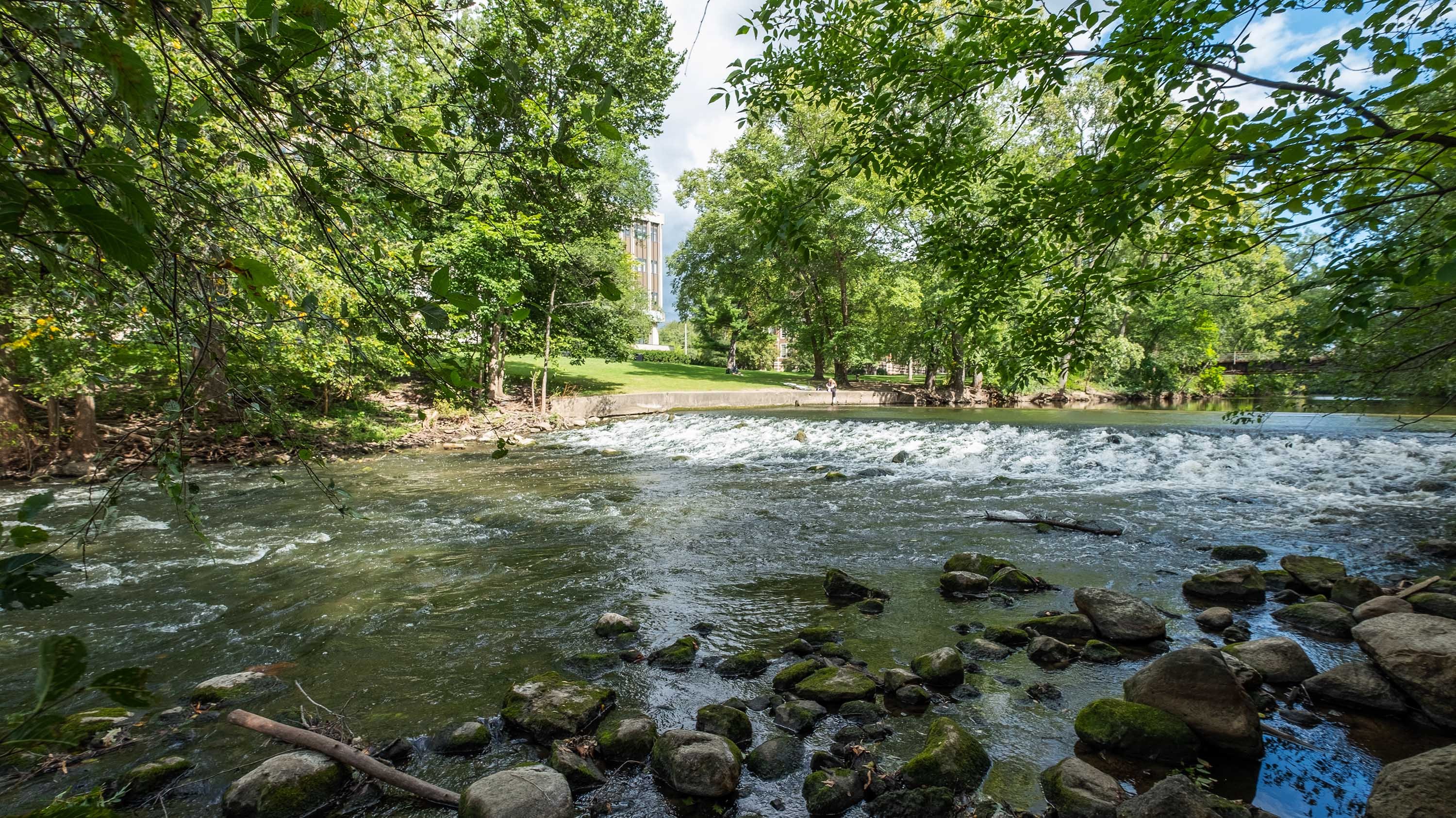 The Red Cedar River, with Hannah Admin and a student in the distance