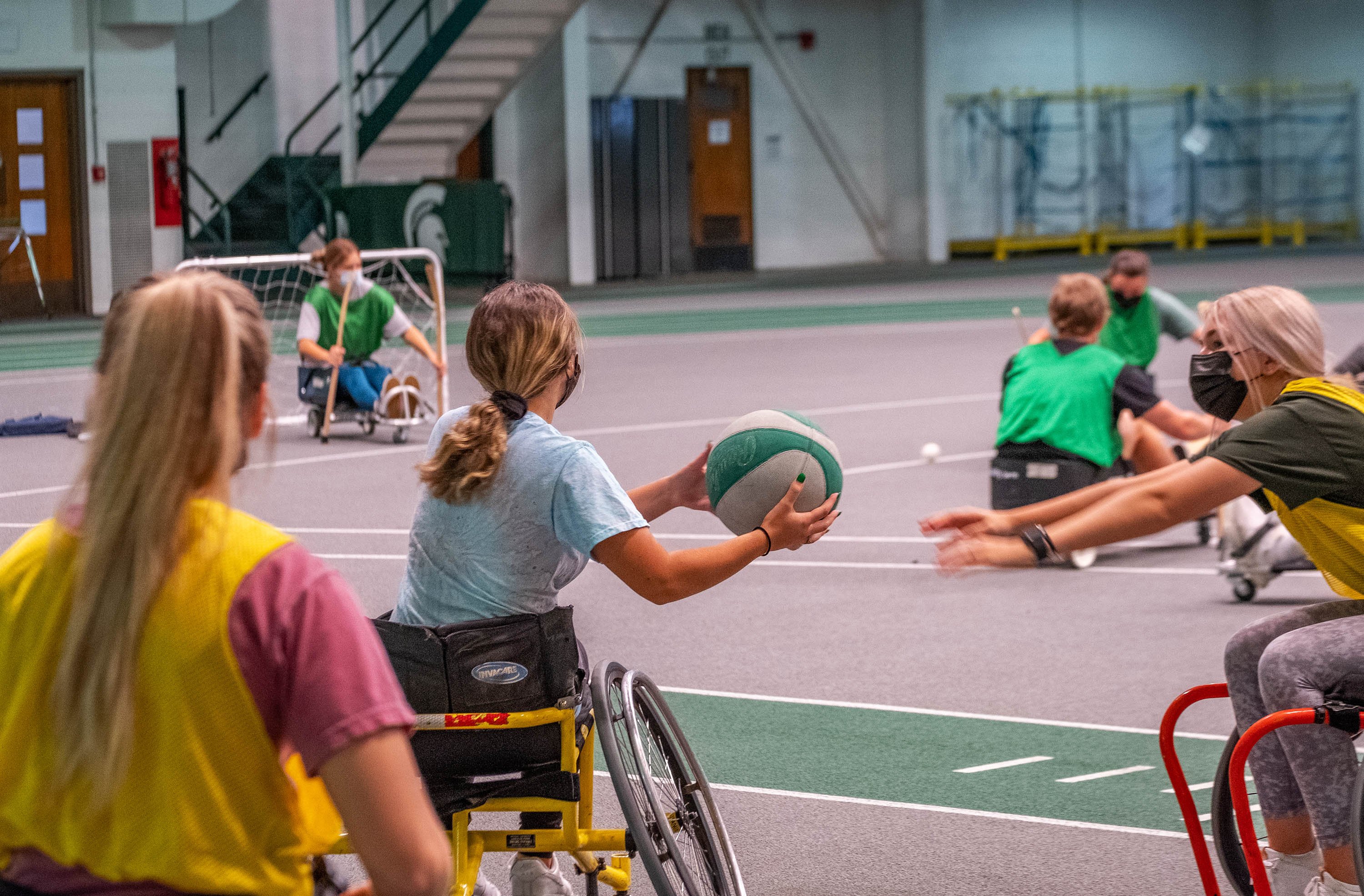 Students playing wheelchair basketball