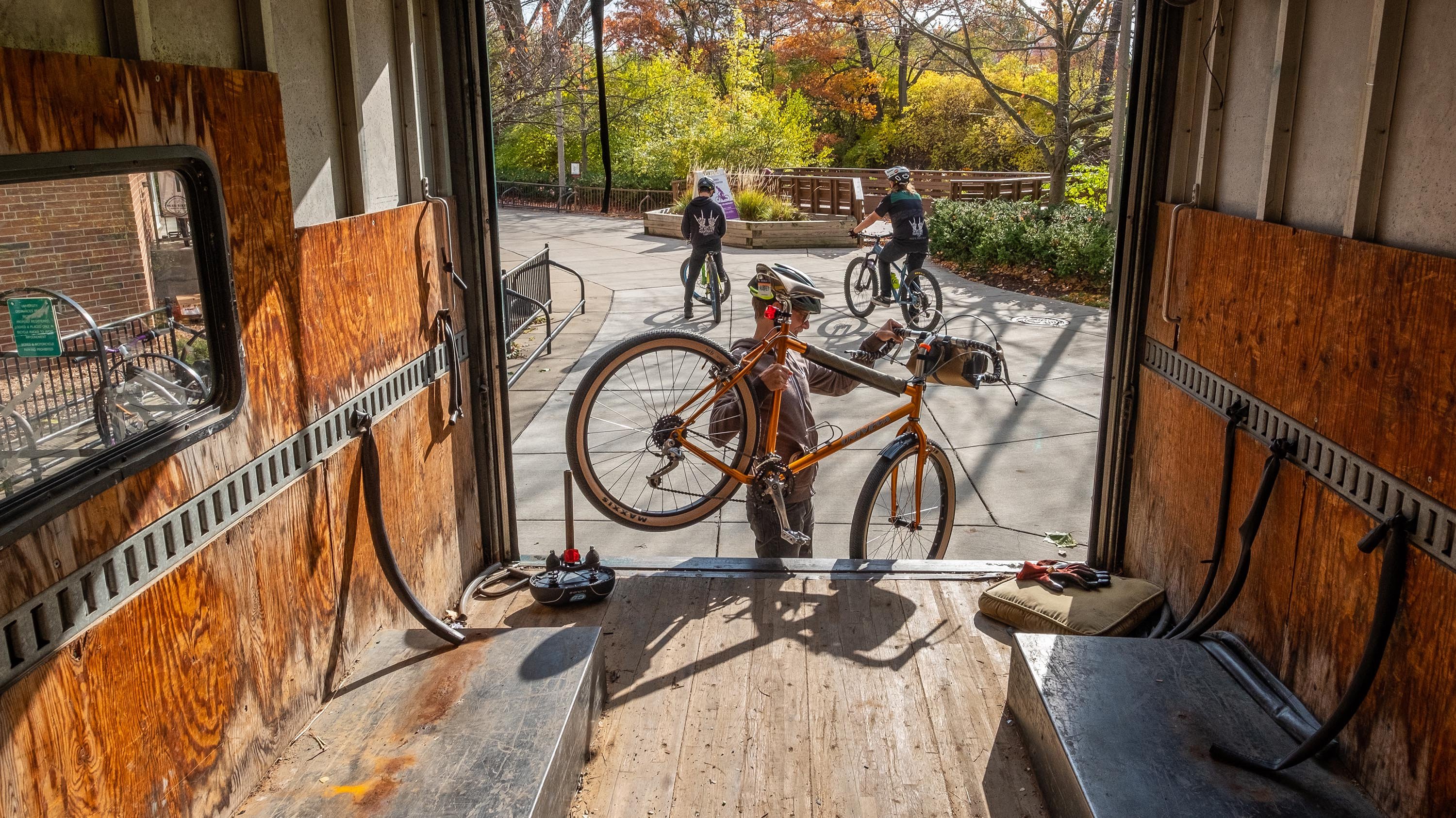 MSU Bikes employee unloading a bike from a truck
