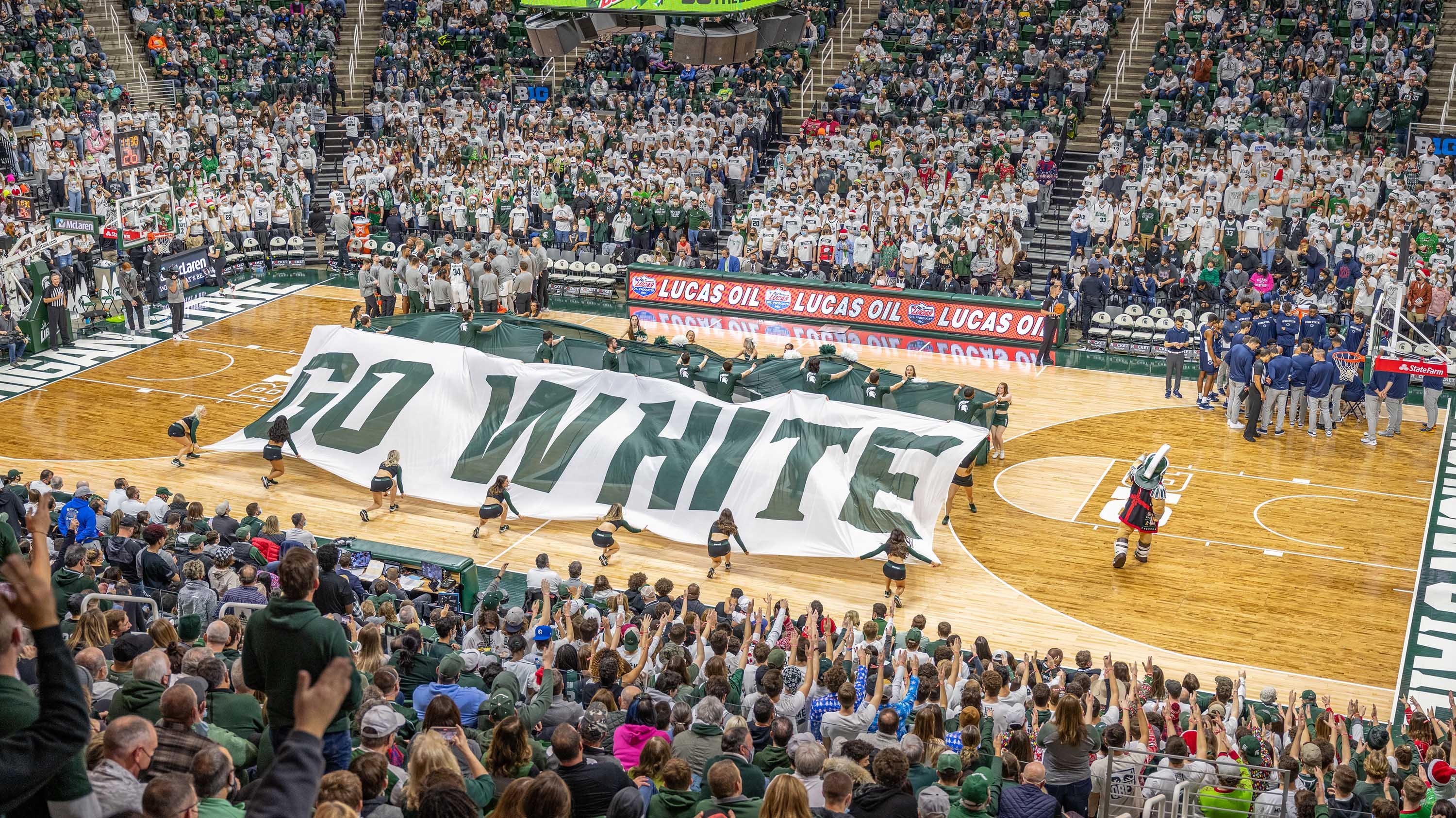 'Go Green Go White' banner on the court during MSU basketball game