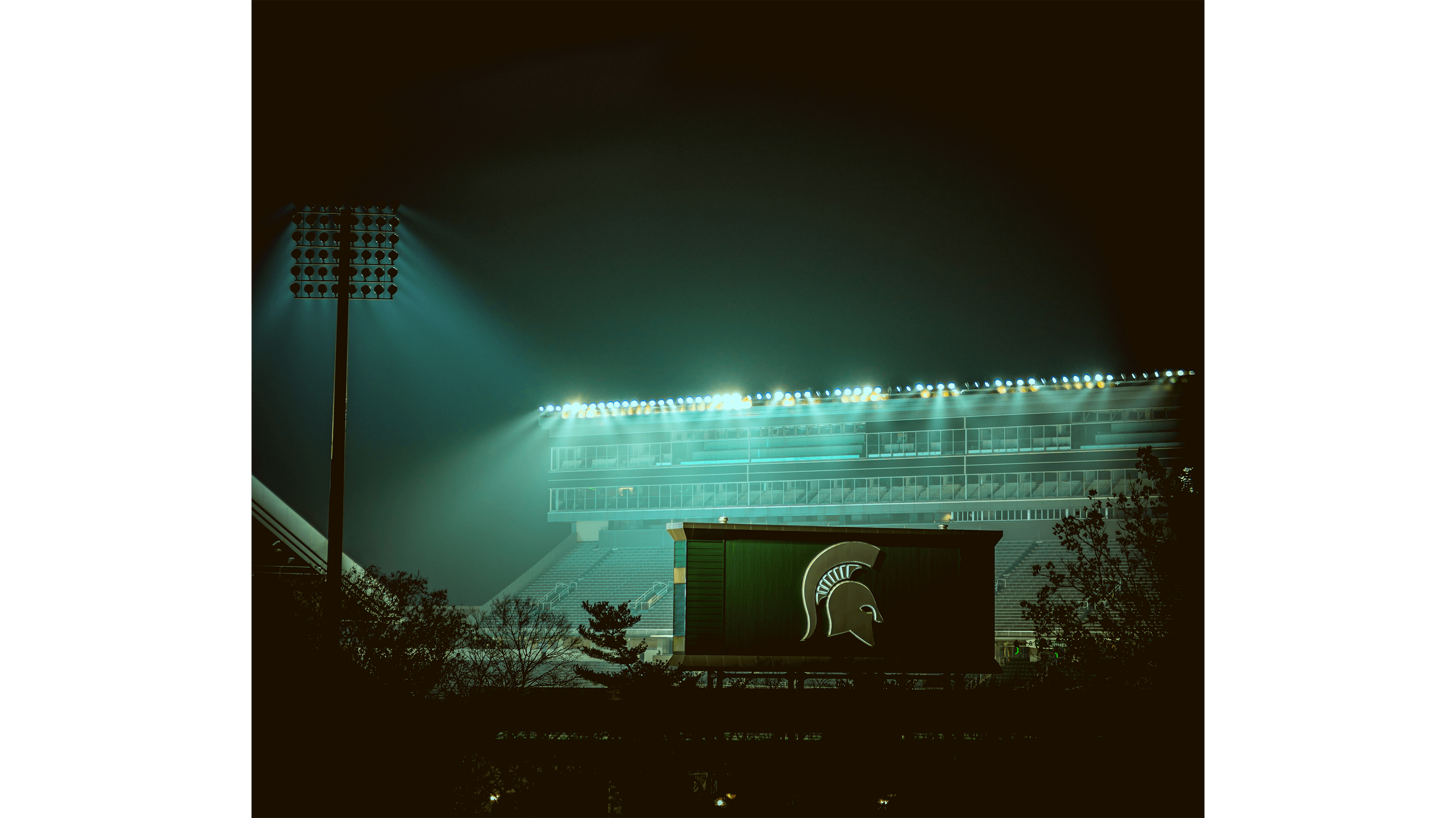 Spartan Stadium aglow with green light
