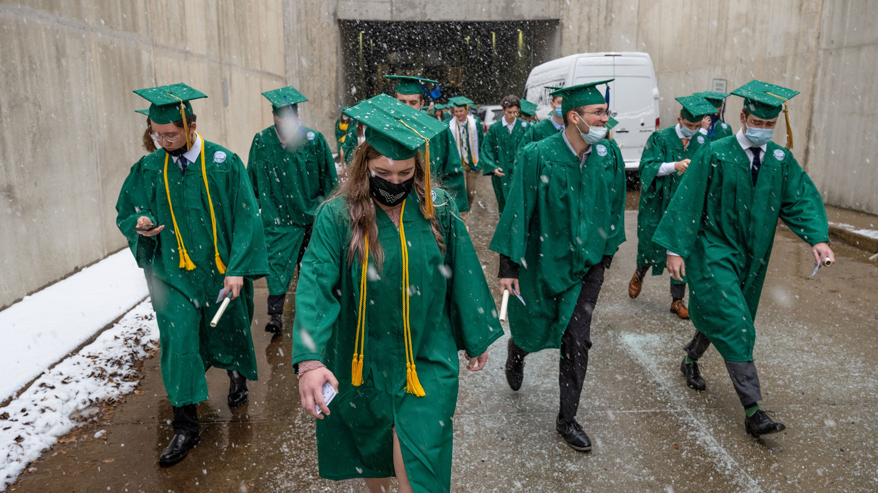 Fall 2021 grads walking in the snow