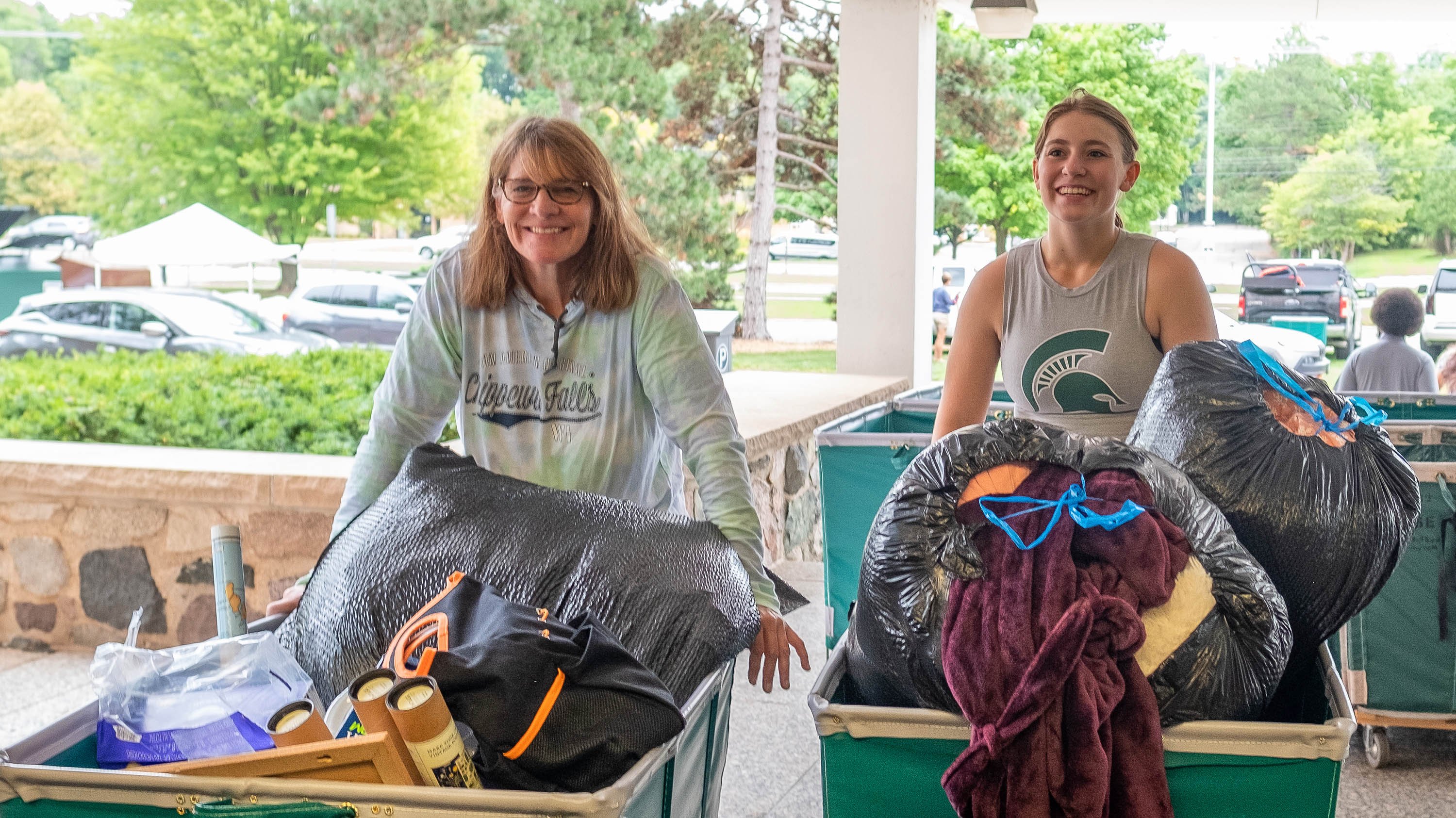 Parent and student moving into a residence hall