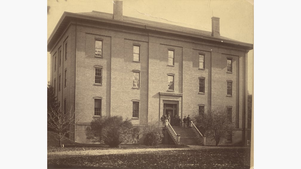 Black and white photograph of the old MAC College Hall