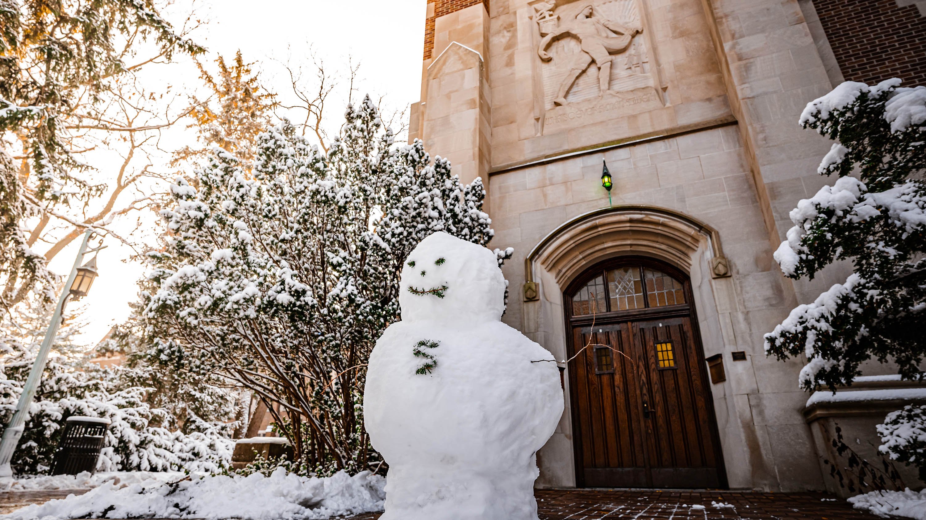 Snowman in front of Beaumont Tower