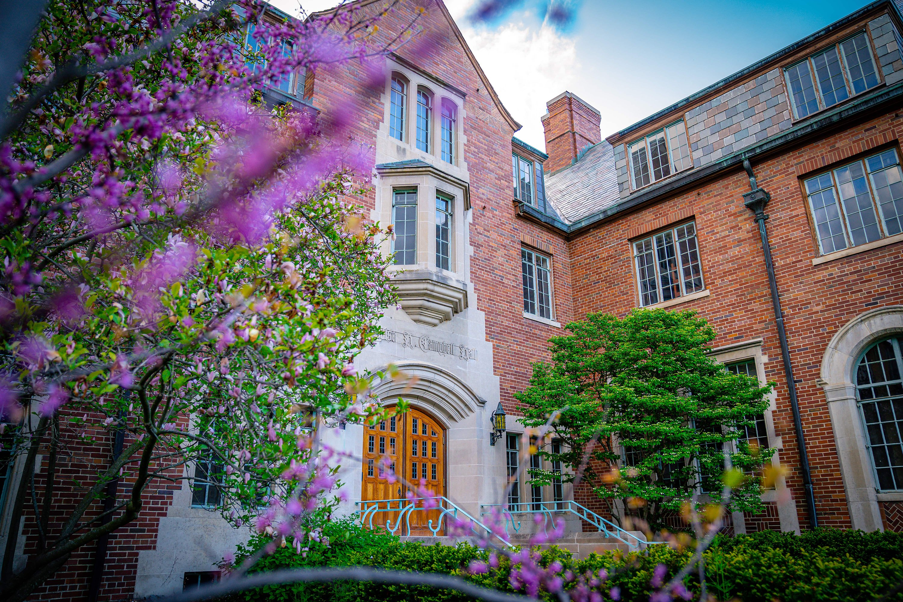 Campbell Hall framed by beautiful spring flowers