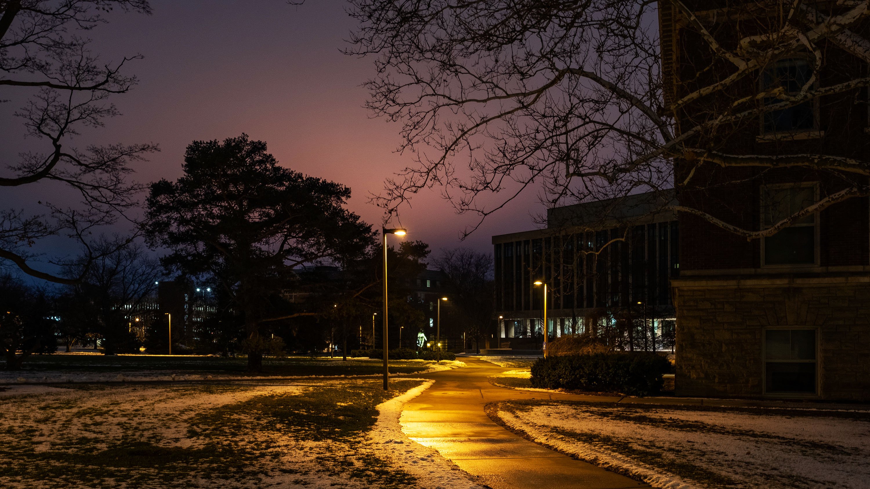 Hannah Administration building and Olds Hall on a winter night.
