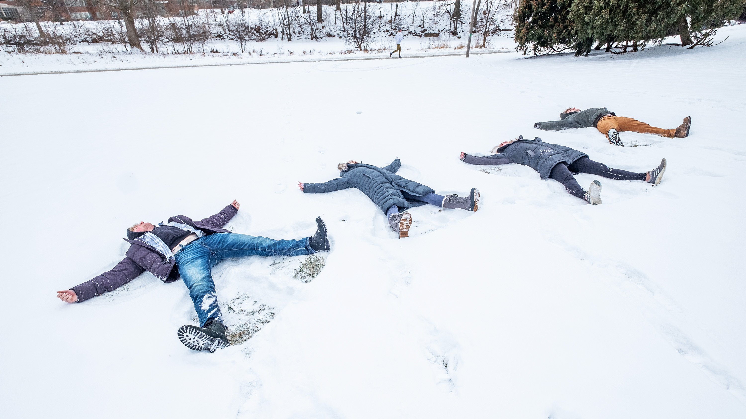 Students making snow angels