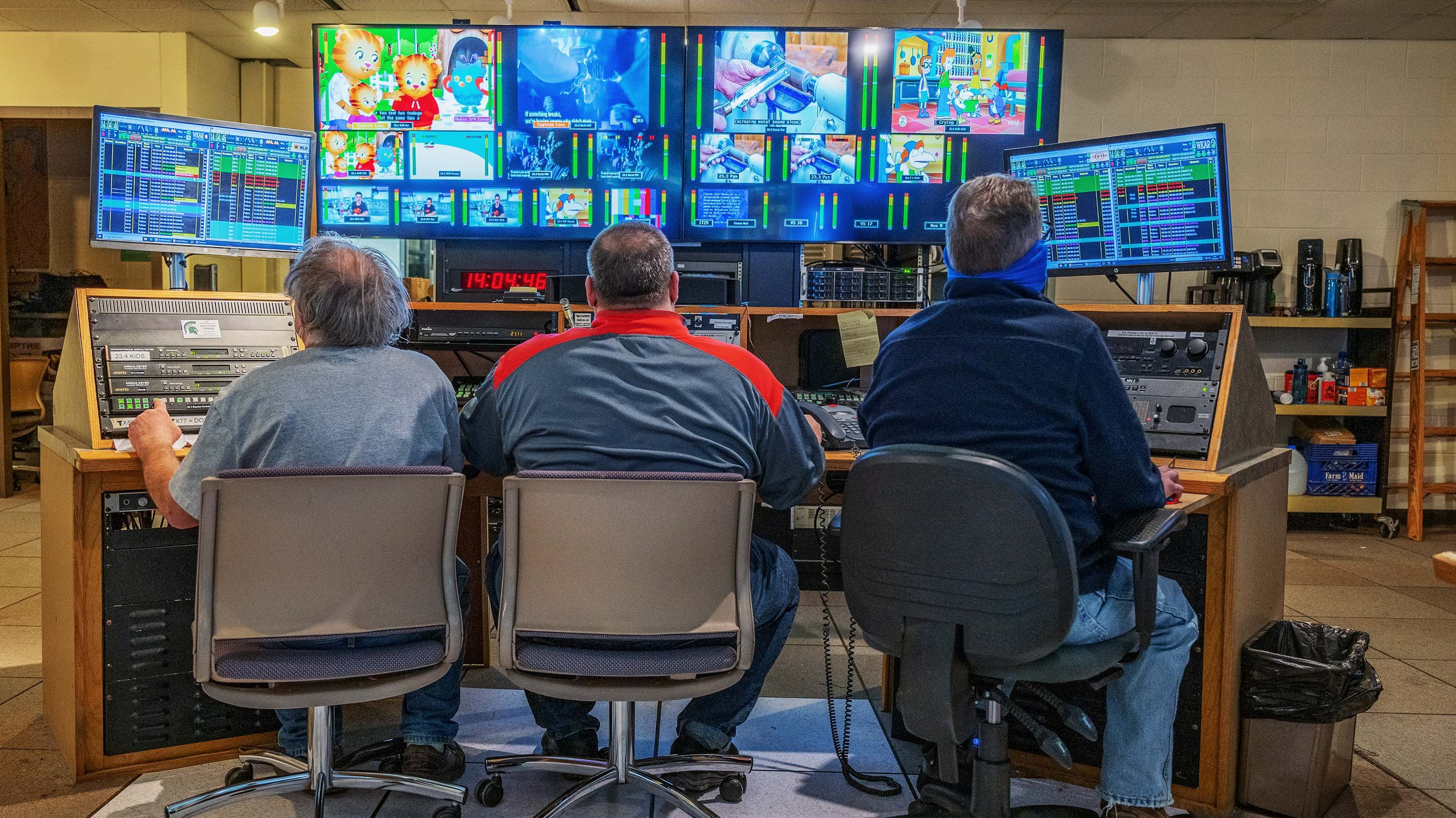 WKAR Master Control room showing (from L to R) Engineer, Rick Thomas; Director of Broadcast Technology, Dave Mann; and Master Control Operator, Dan Drolett at the main ?Day of Air? console.