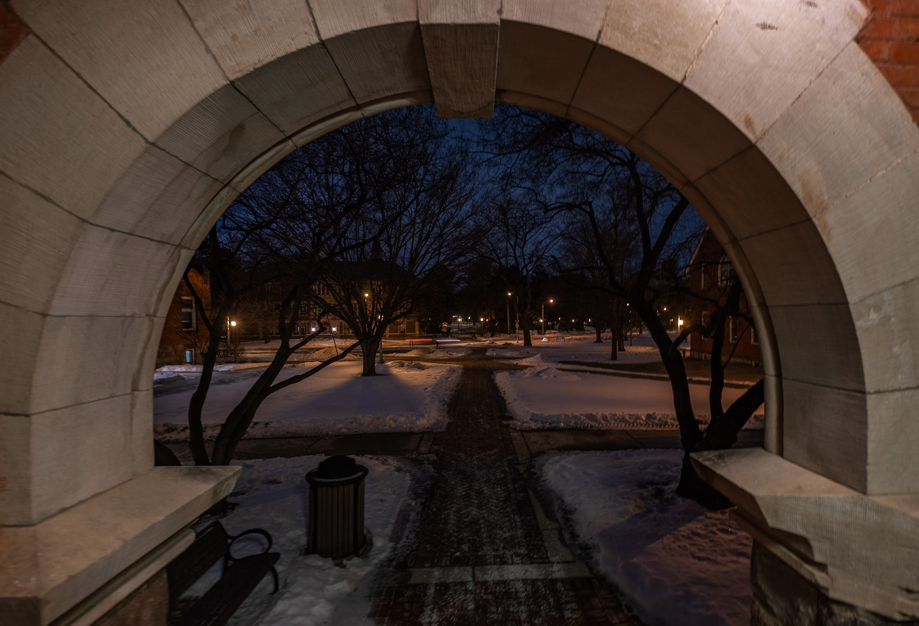 West Circle Drive on a winter night, viewed from the Marshall-Adams Hall.