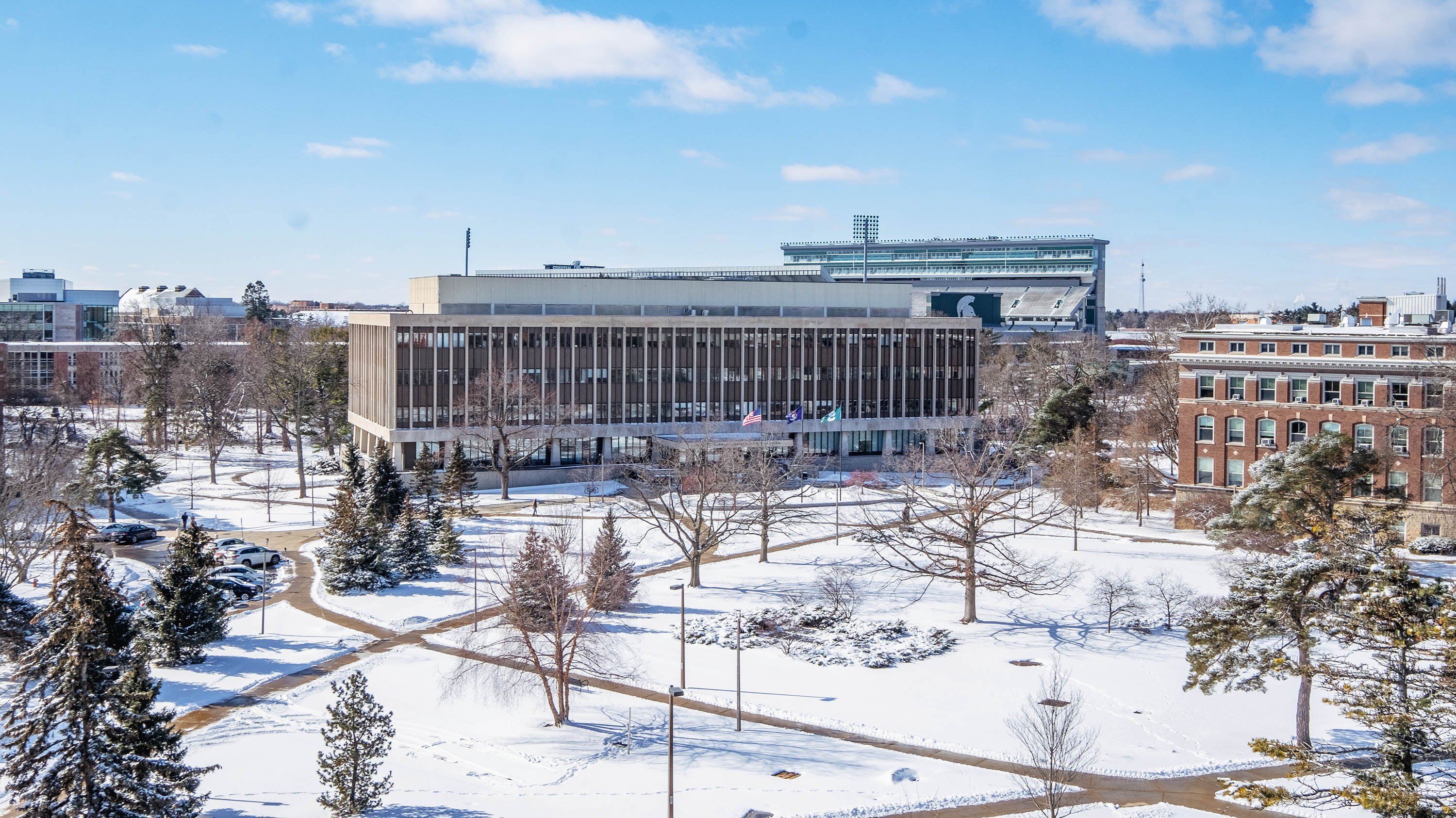 Birds-eye view of campus in winter showing Hannah Administration building
