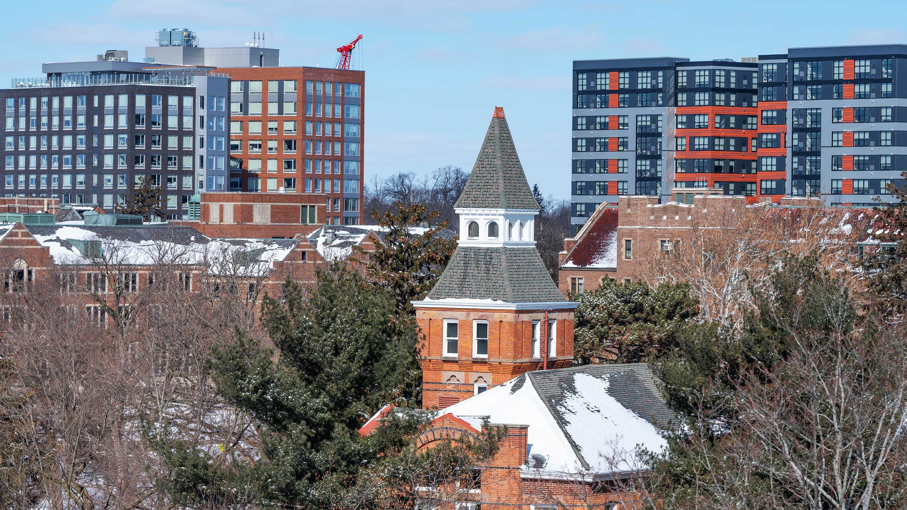 Spire of Linton Hall in front of modern Grand River buildings