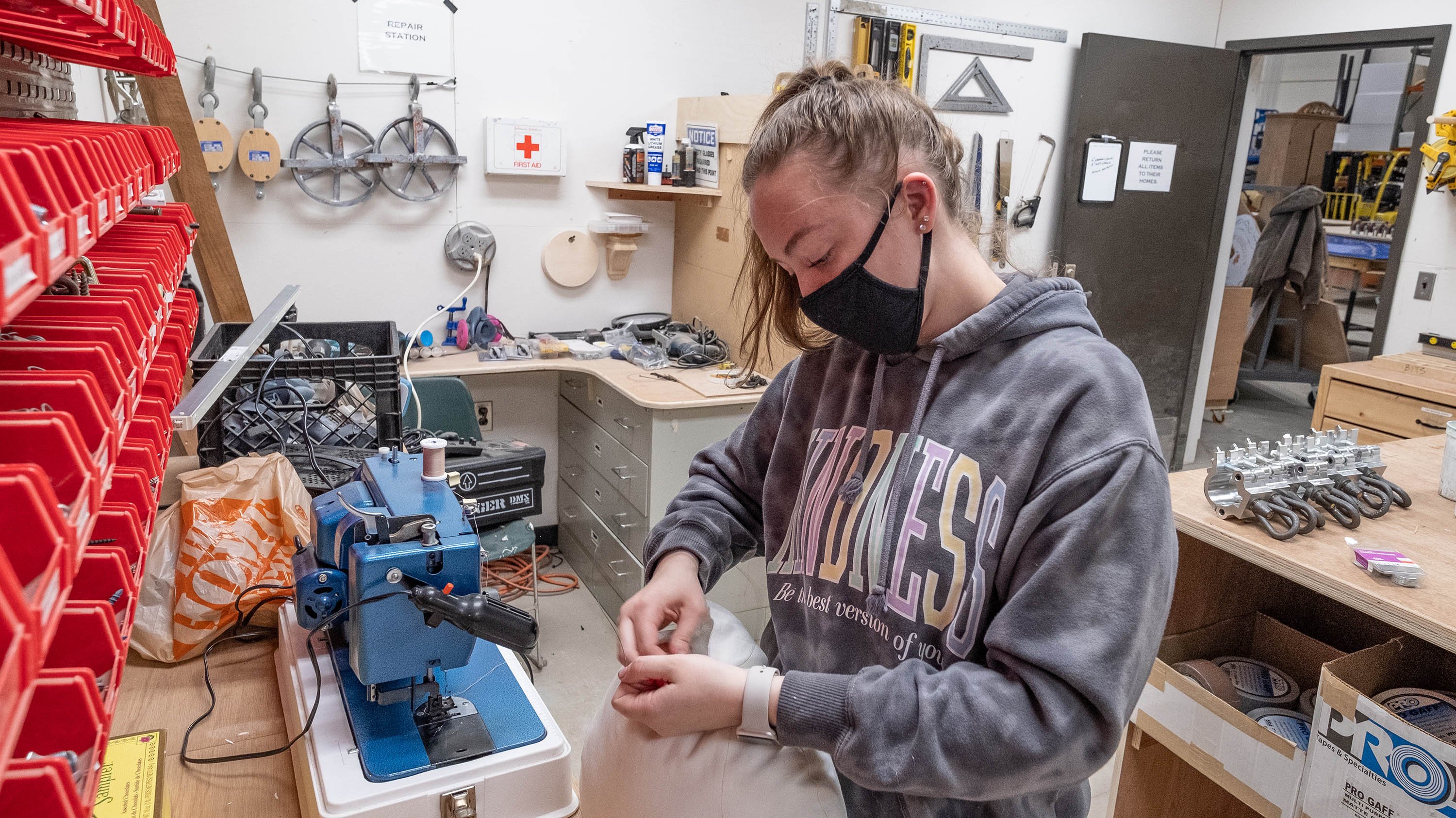 Student working in scene shop