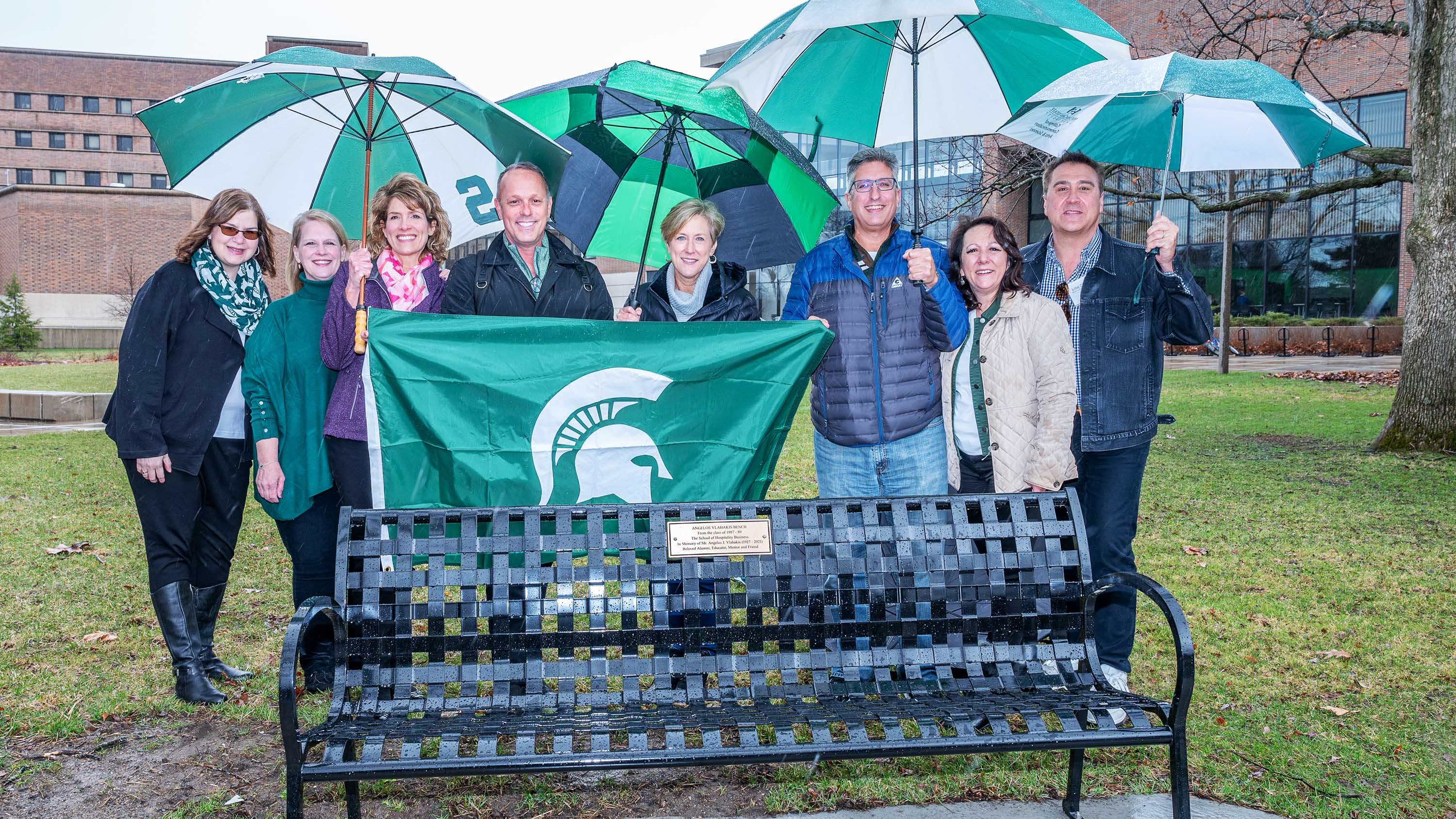 Group posing for picture at bench dedication ceremony