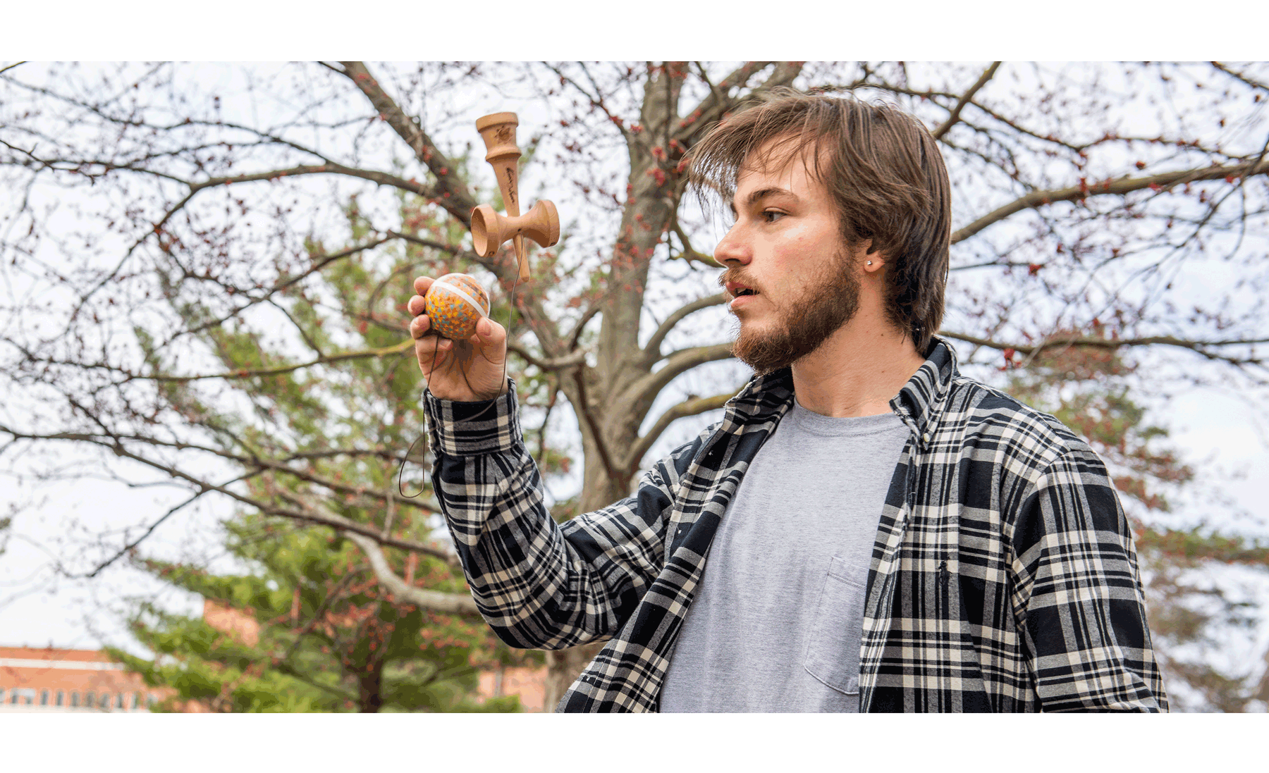 Biosystems Engineering senior Chance Poulos playing with a kendama