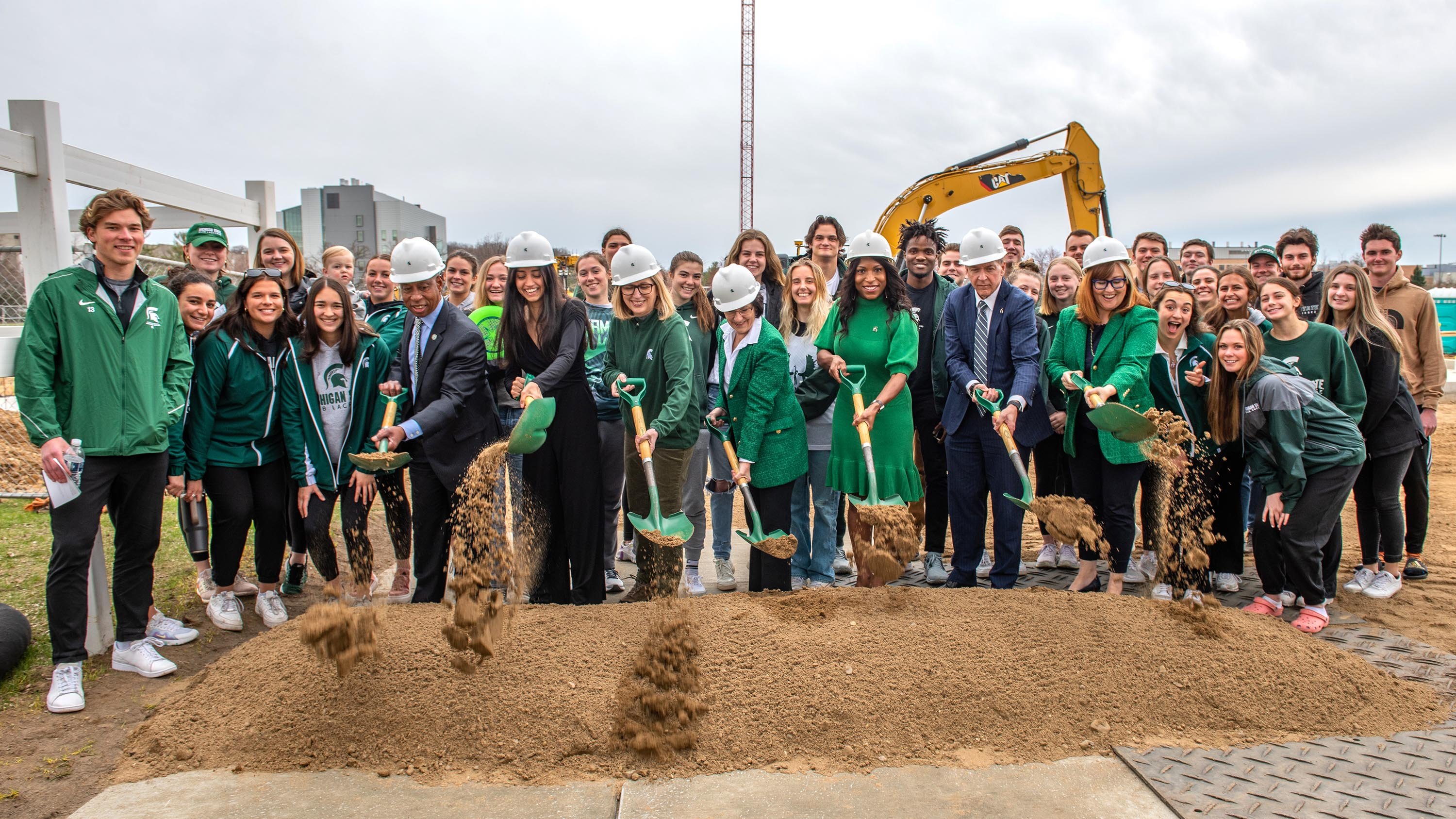 Student athletes and MSU leadership at Service Road field groundbreaking ceremony