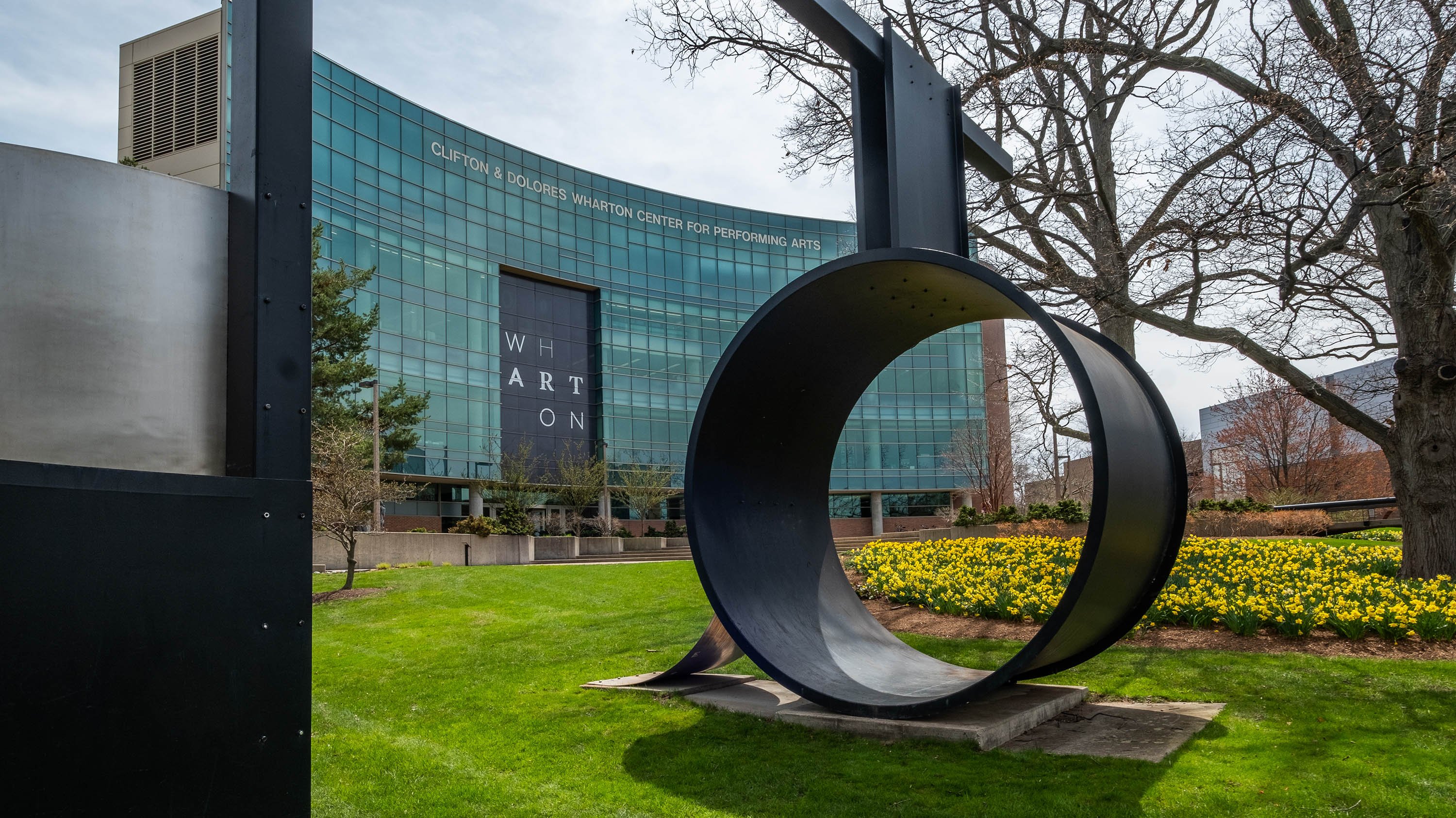 'Orpheus' sculpture in front of Daffodils and Wharton Center