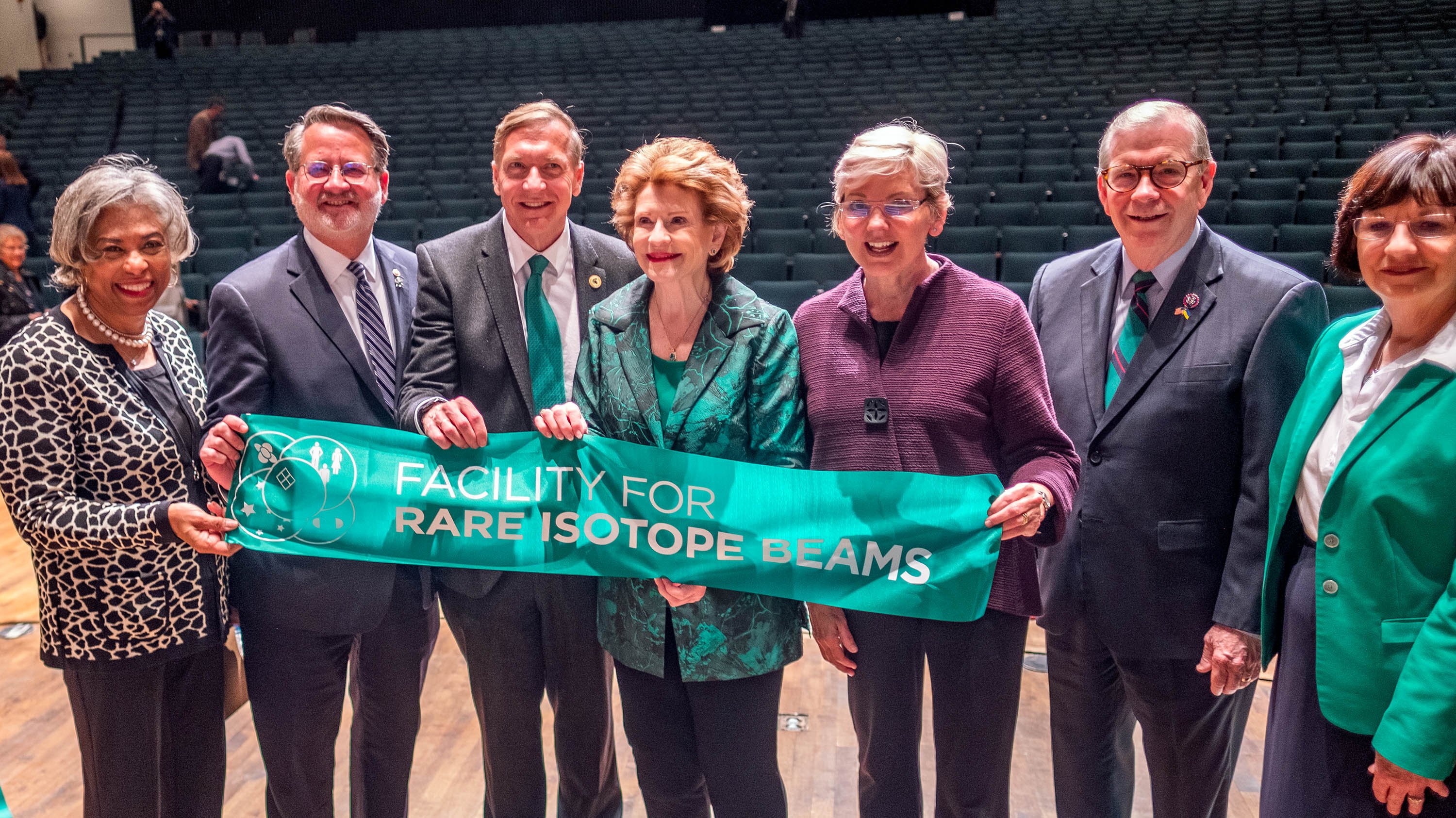 Leaders posing with ribbon at FRIB ribbon-cutting ceremony