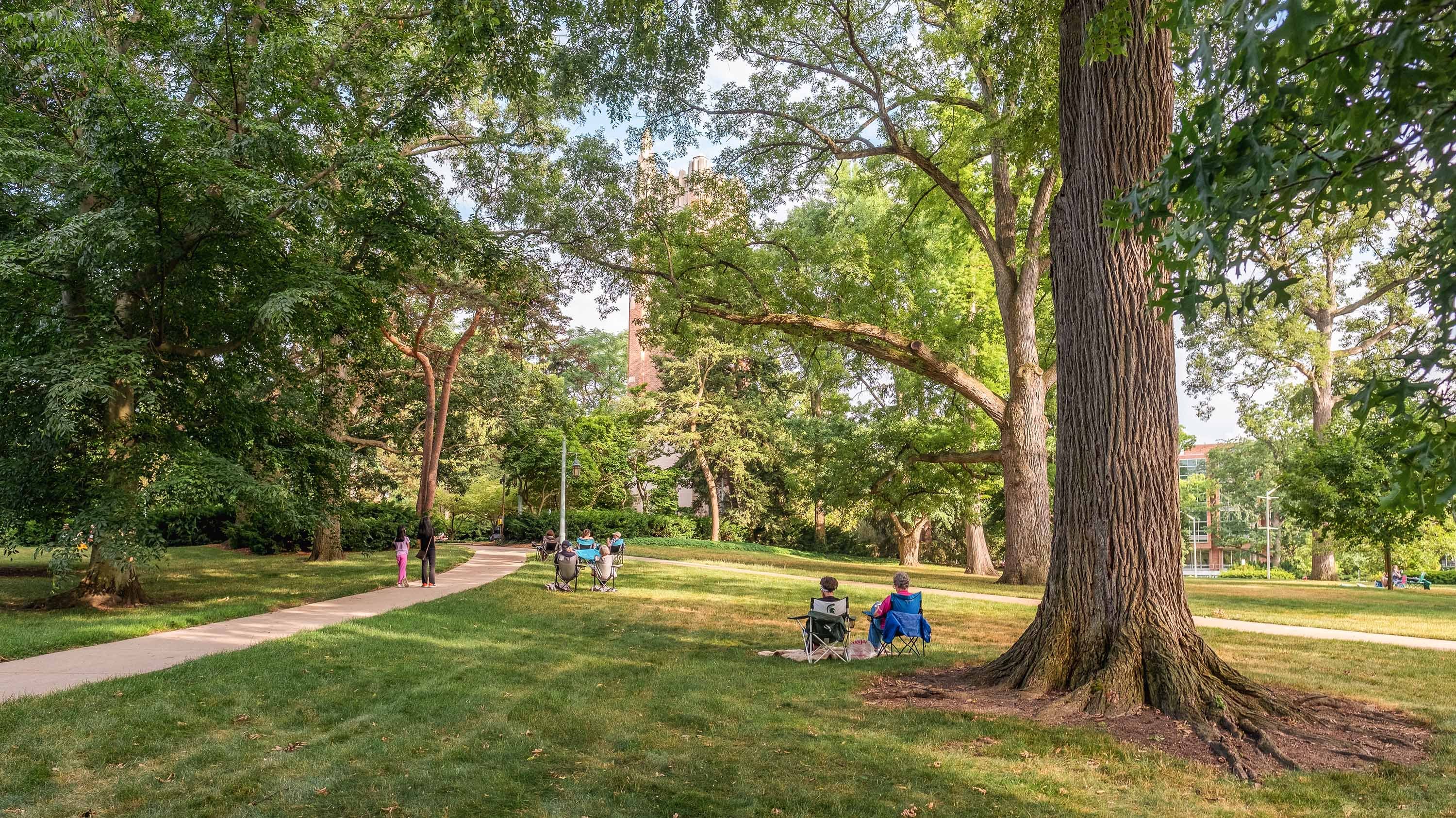 View of campus overlooking Beaumont Tower and people watching carillon concert