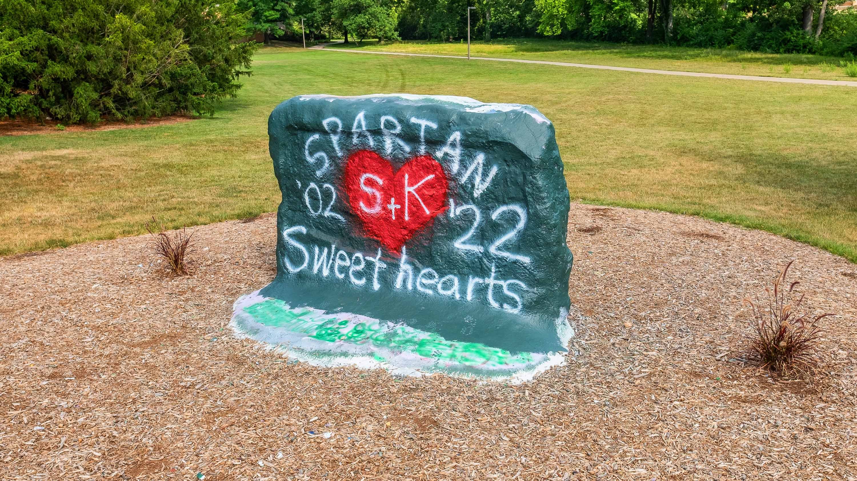 The Rock with 'Spartan Sweethearts S+K' painted on the surface