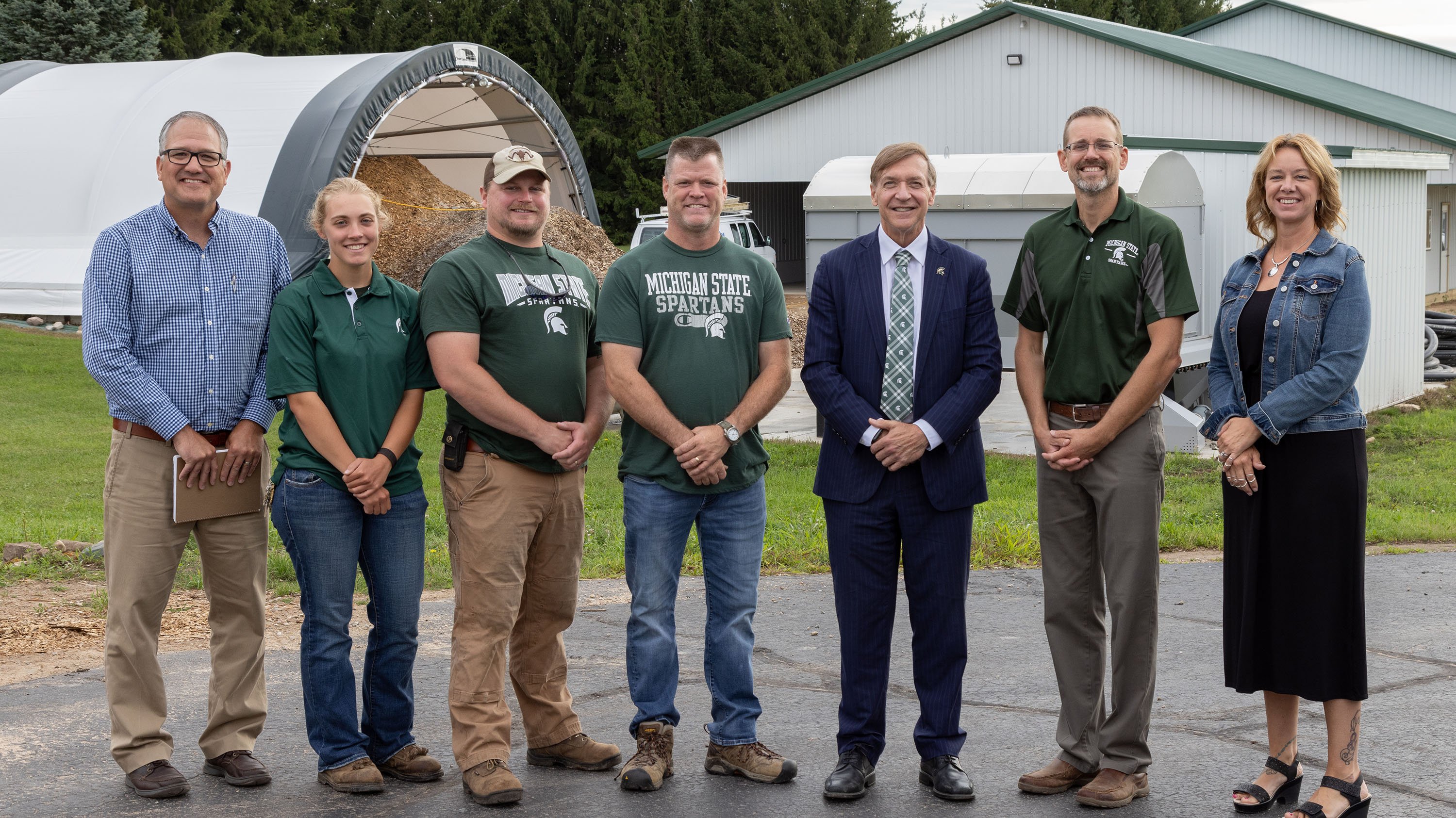 President Stanley posing for a photo with members of the Forestry Innovation Center