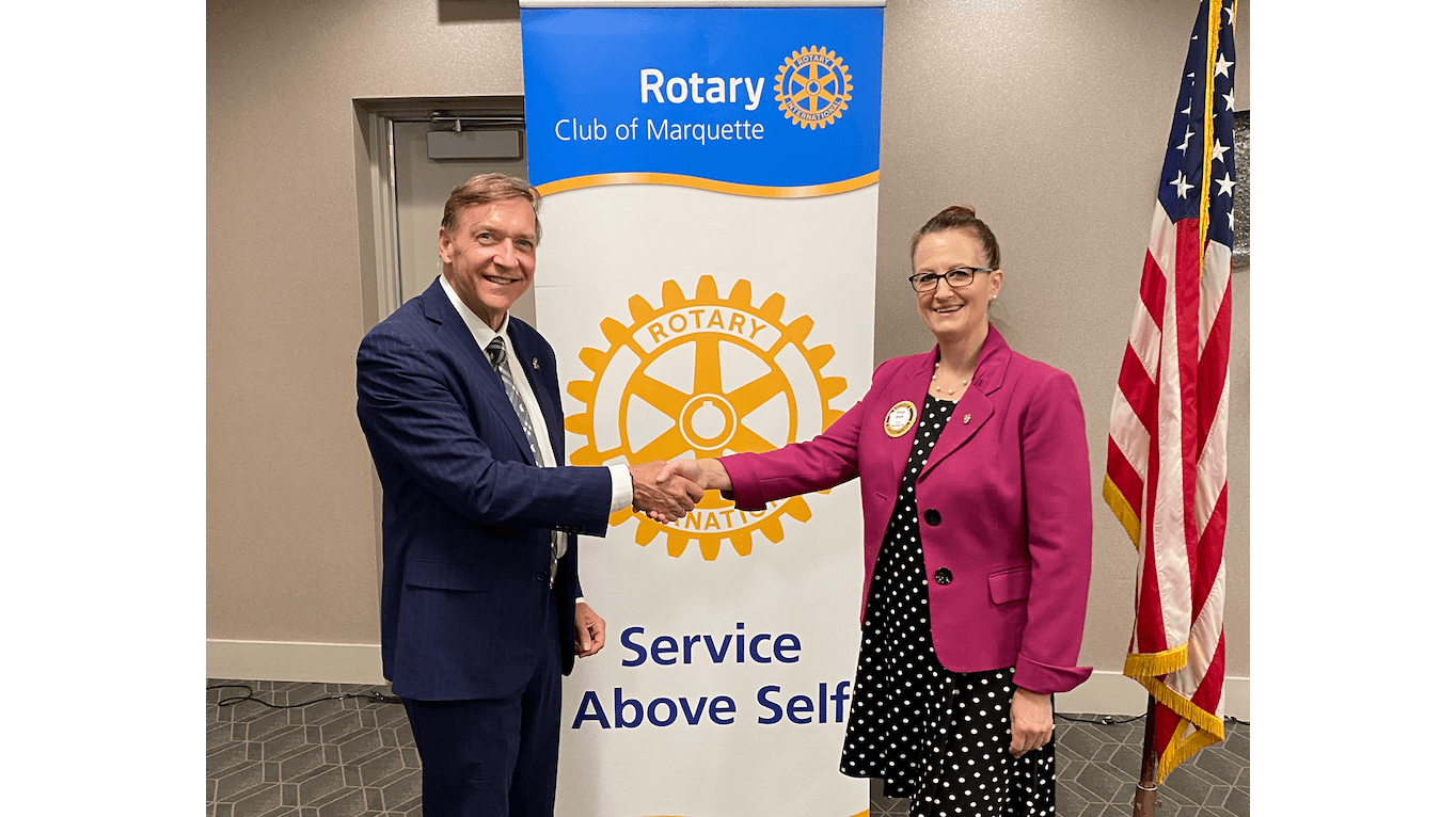 President Stanley meets with the Marquette Rotary Club and its president, Erica Huss. 