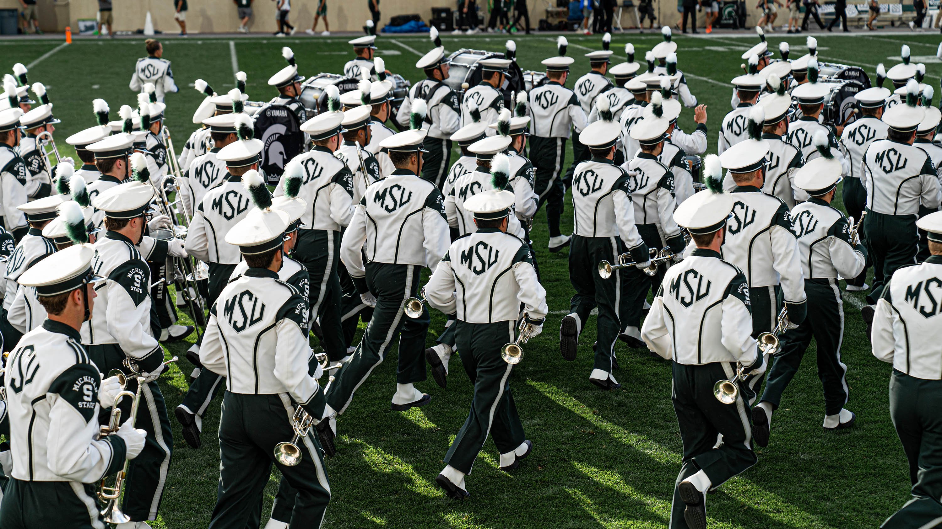 Spartan Marching Band walking onto the field during Akron game