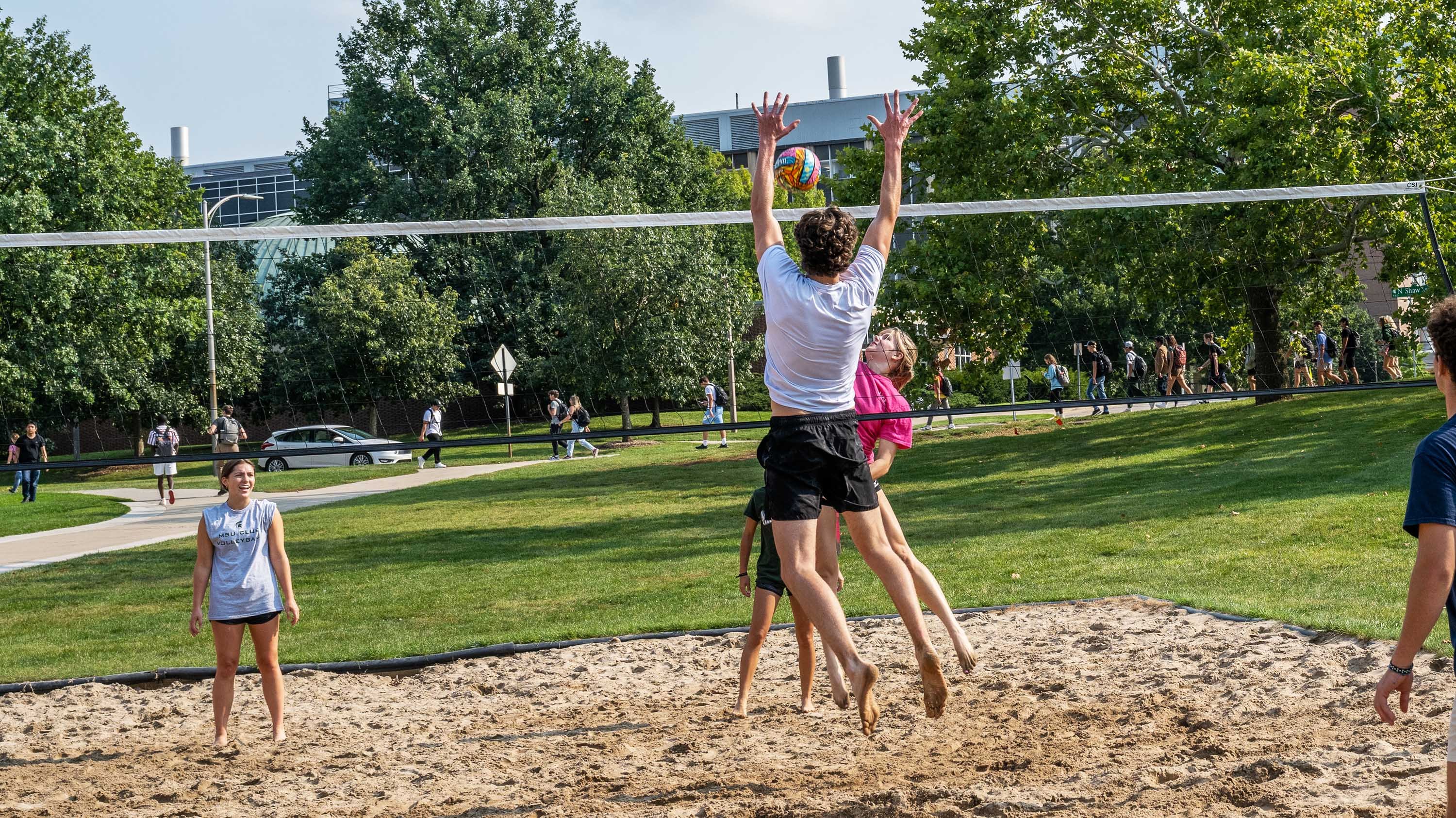 Students playing volleyball