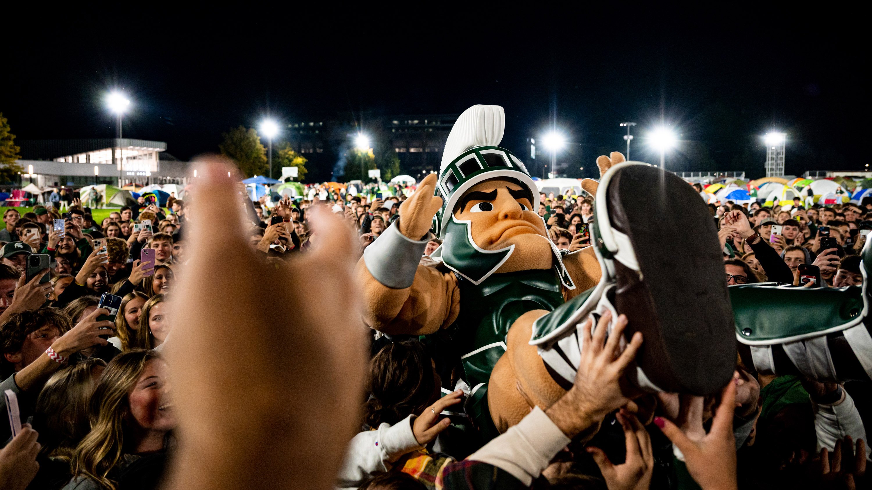 Sparty mascot crowd-surfing at Izzone campout