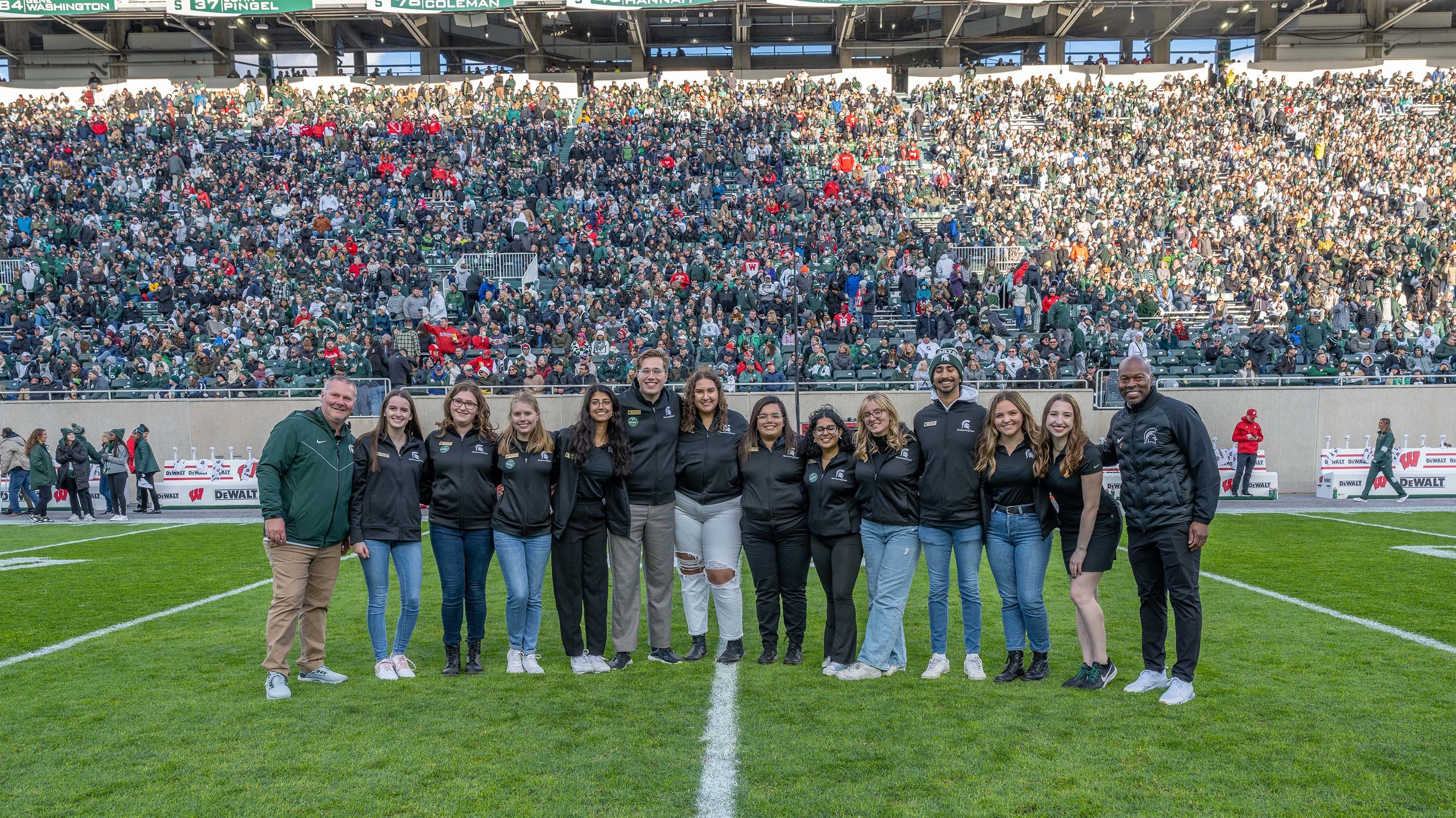 Members of the homecoming court in Spartan Stadium