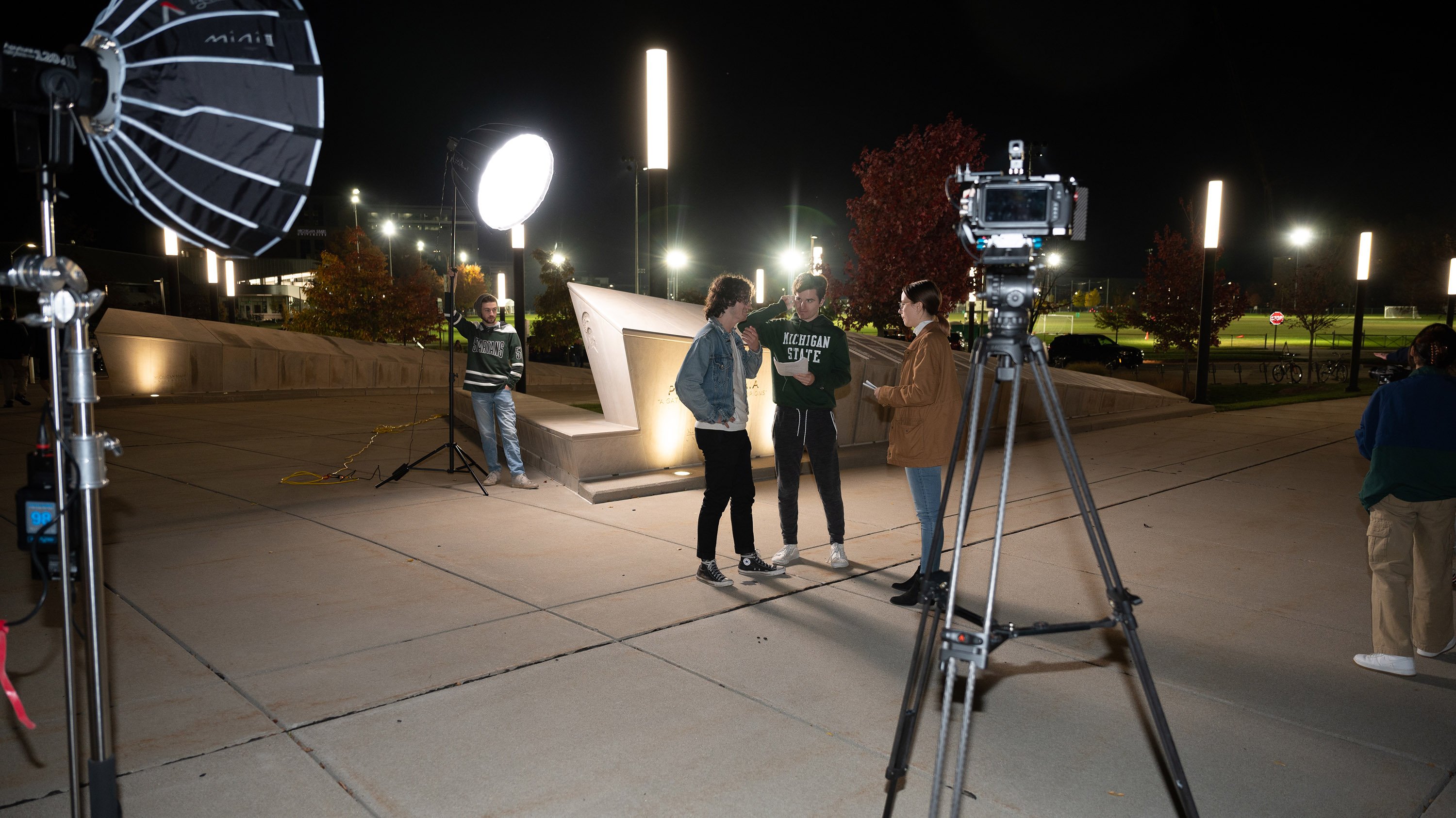 Students shooting a short film at night