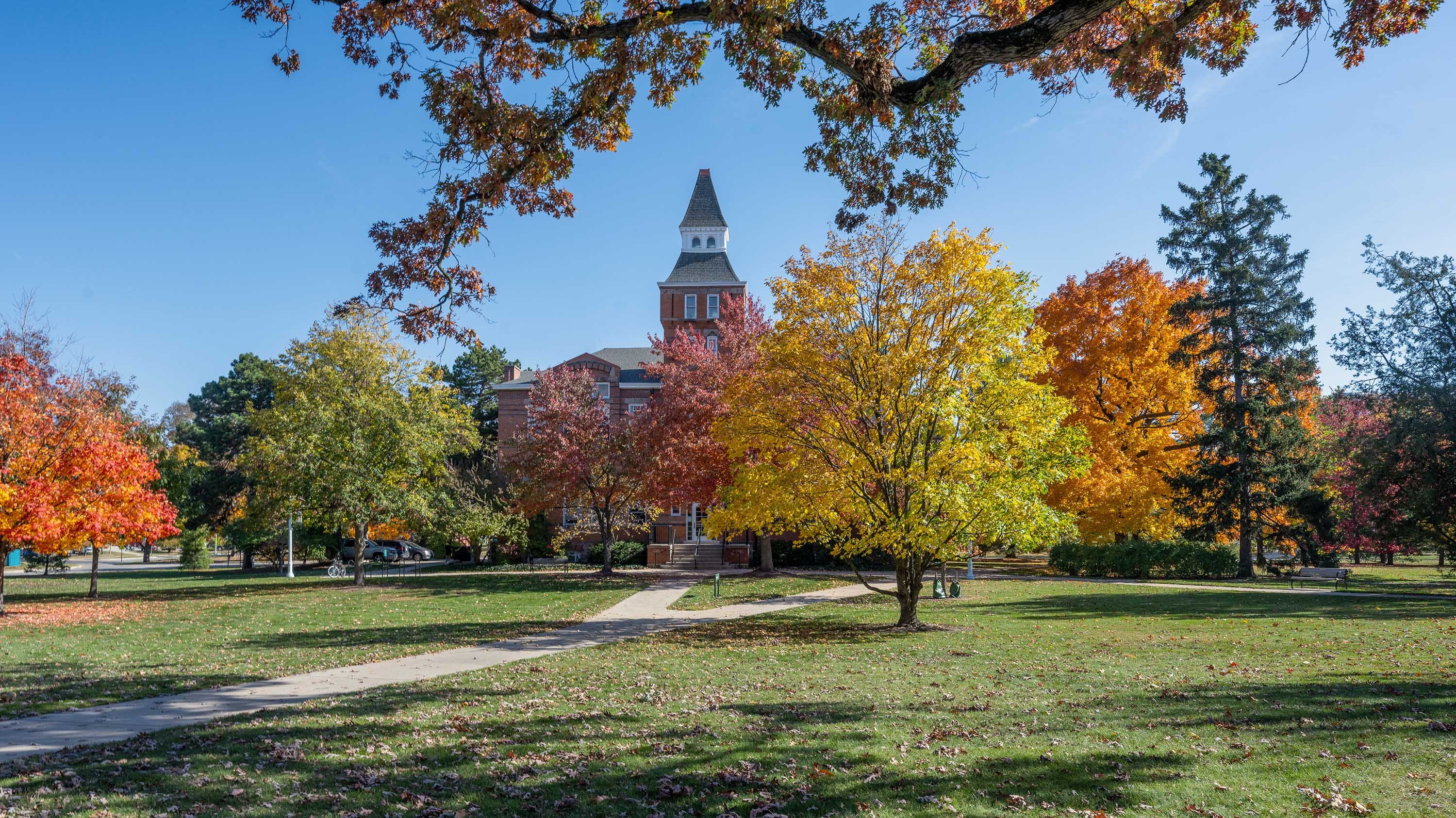 Linton Hall behind autumn trees