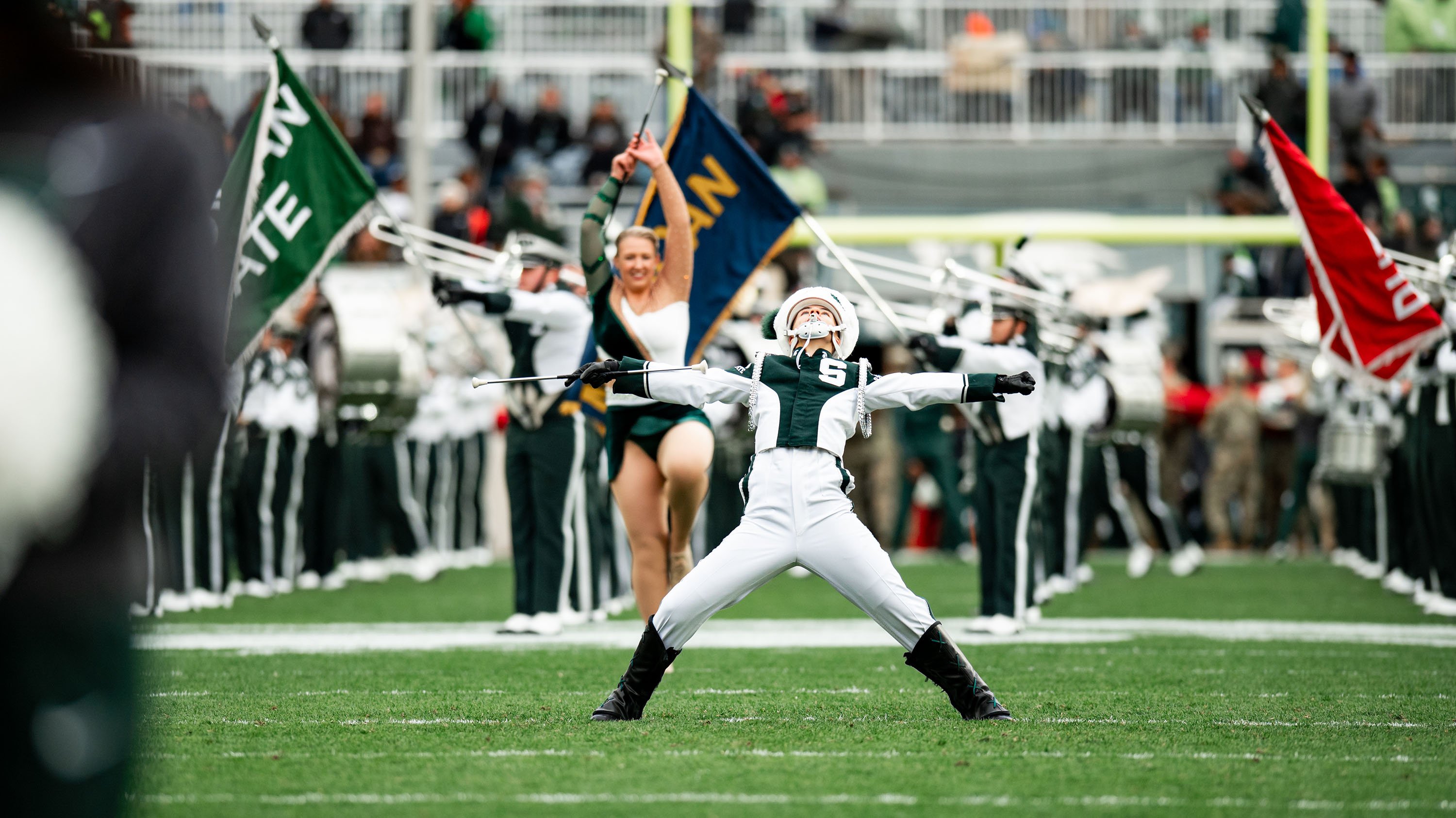 Member of marching band posing during halftime show