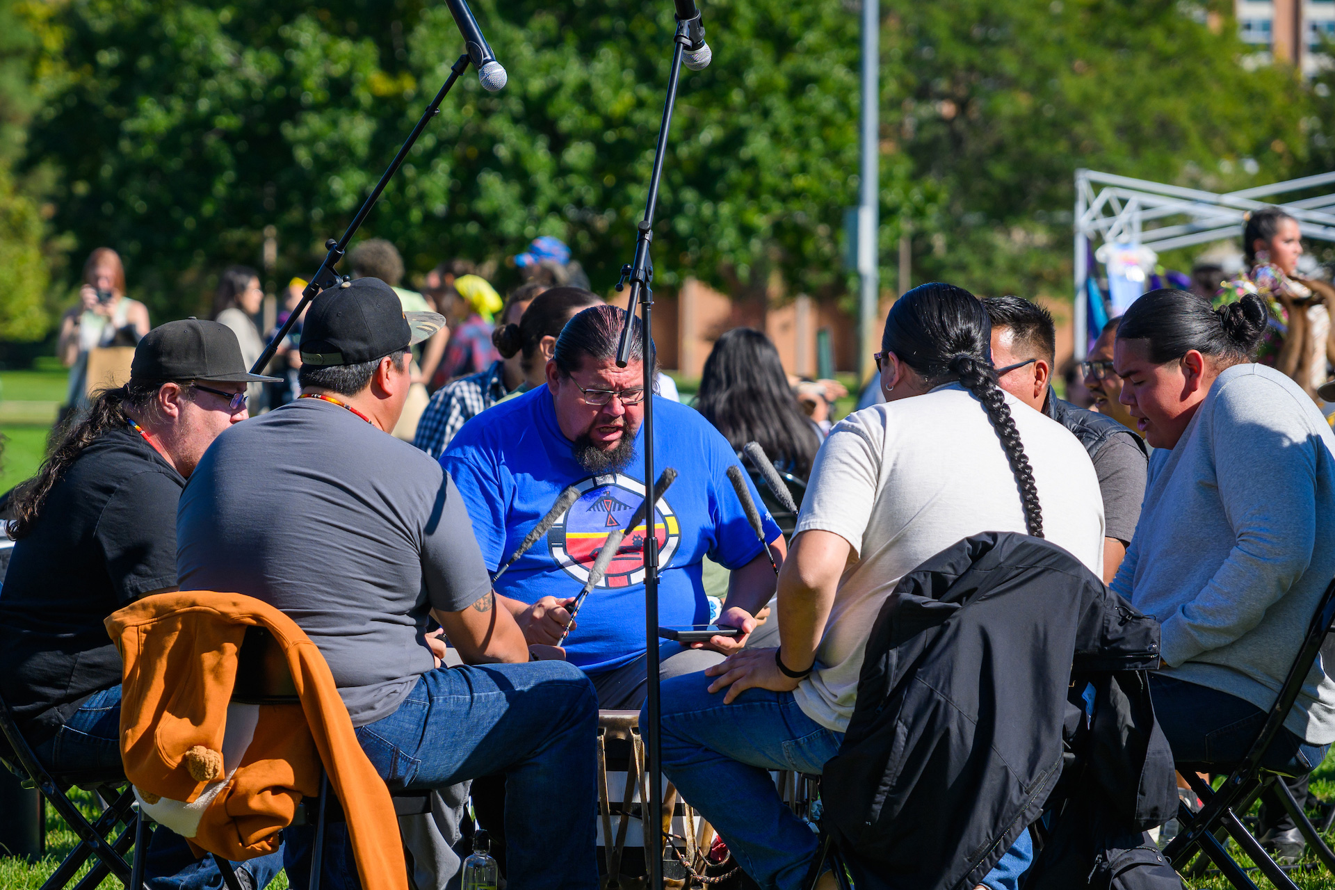 drummers sitting in the middle of the circle.