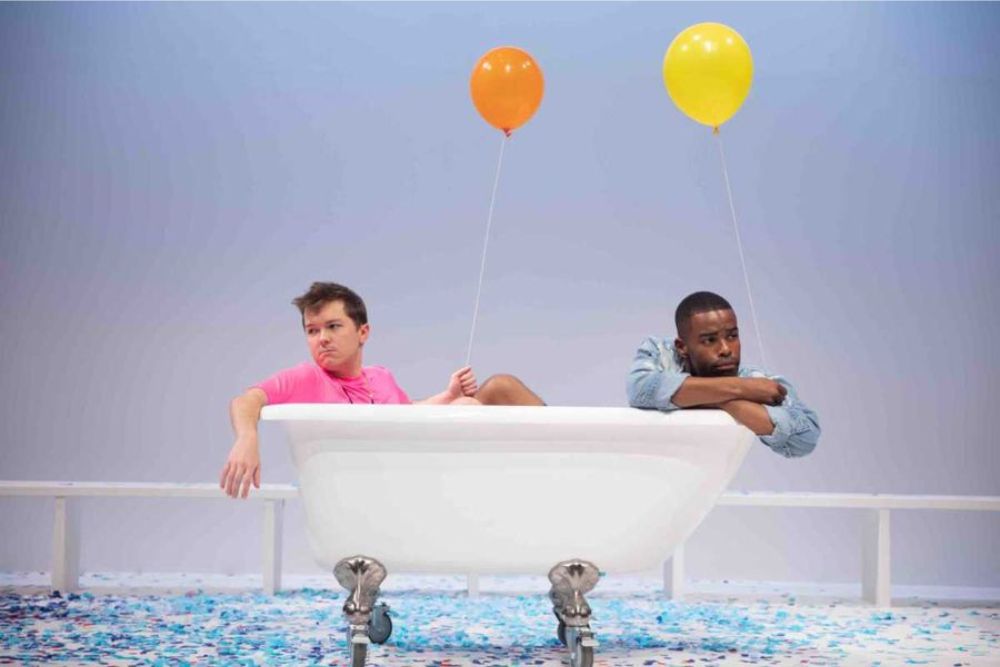 The re-imaging of The Fantasticks features two young men as the lovers at the center of the story. Pictured are actors Neil McCaffrey (as Lewis) and Jeremiah Porter (as Matt) from the national premiere of the rewritten production through the Flint Repertory Theatre. Photo credit: Mike Naddeo