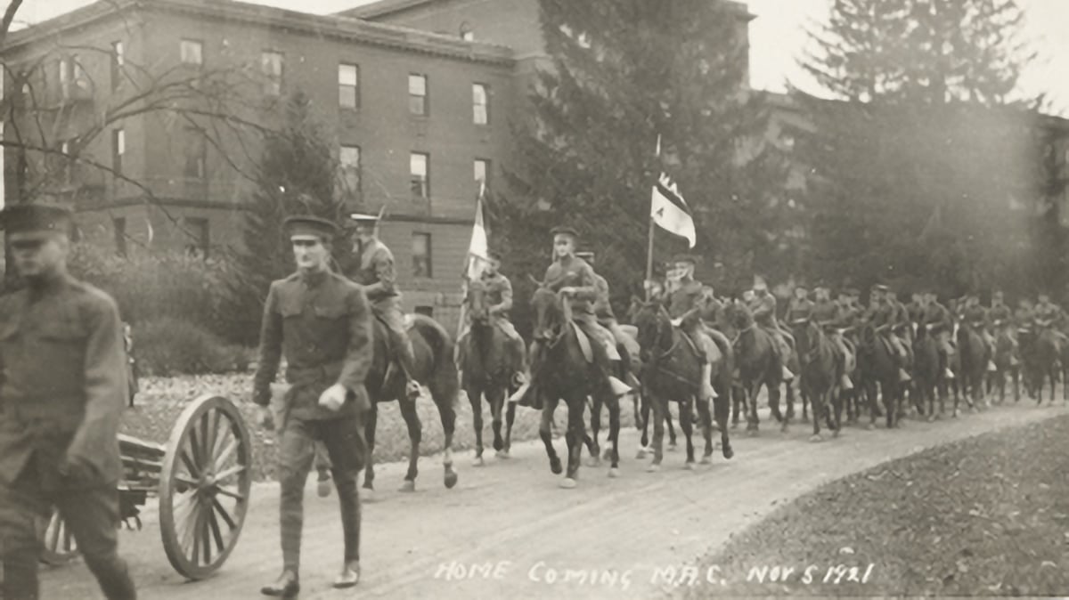Vintage photo of people on horseback during 1921 homecoming parade