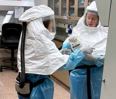 Virology Section academic specialist Annabel Wise and section supervisor Danielle Thompson unpack samples collected from birds suspected to be infected with highly pathogenic avian influenza in the Laboratory’s biosafety level 3 area.