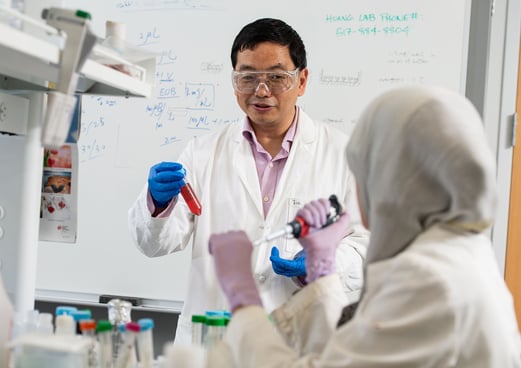 MSU chemist Xuefei Huang and Zahara Rashidijahanabad working in the Huang Group lab.