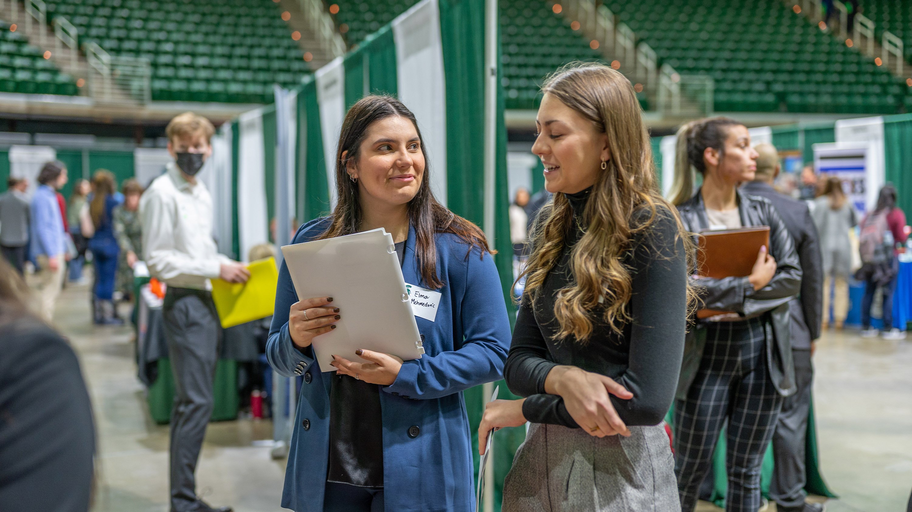 Two students talking at DEI career fair
