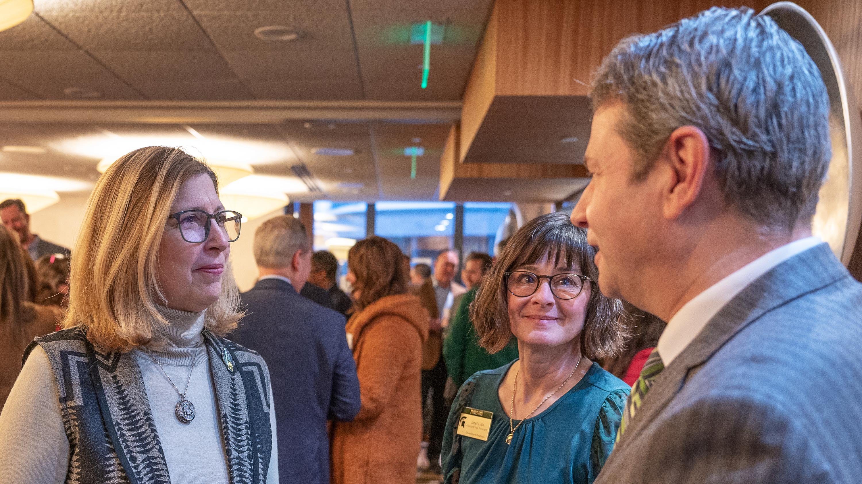 MSU Interim President Dr. Teresa Woodruff,  MSU's Janet Lillie, Assistant Vice President for Community Relations, and Lansing Community College President Steve Robinson at the Community Leaders Breakfast at the Kellogg Center