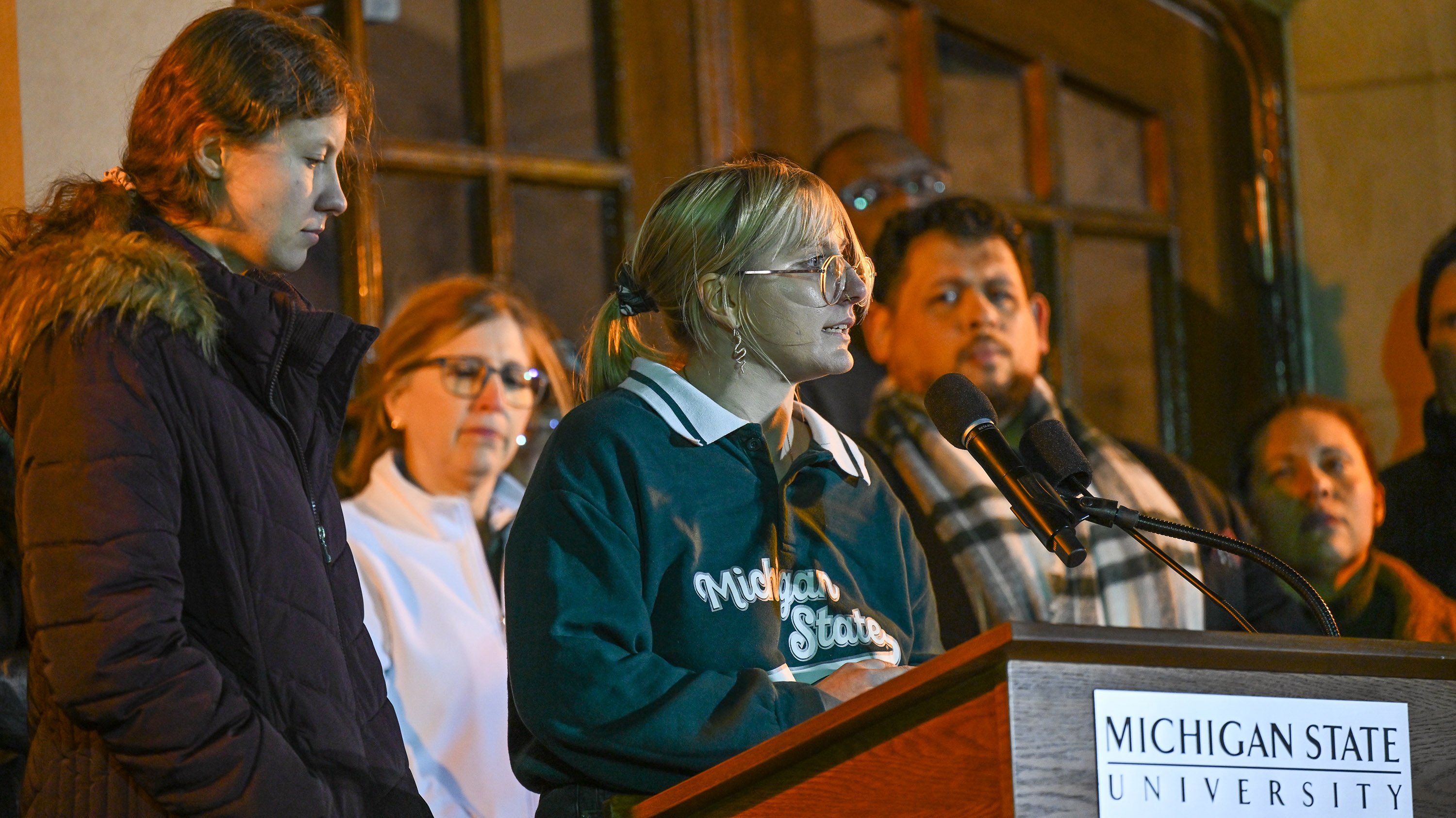 ASMSU president Jo Kovach speaking at vigil